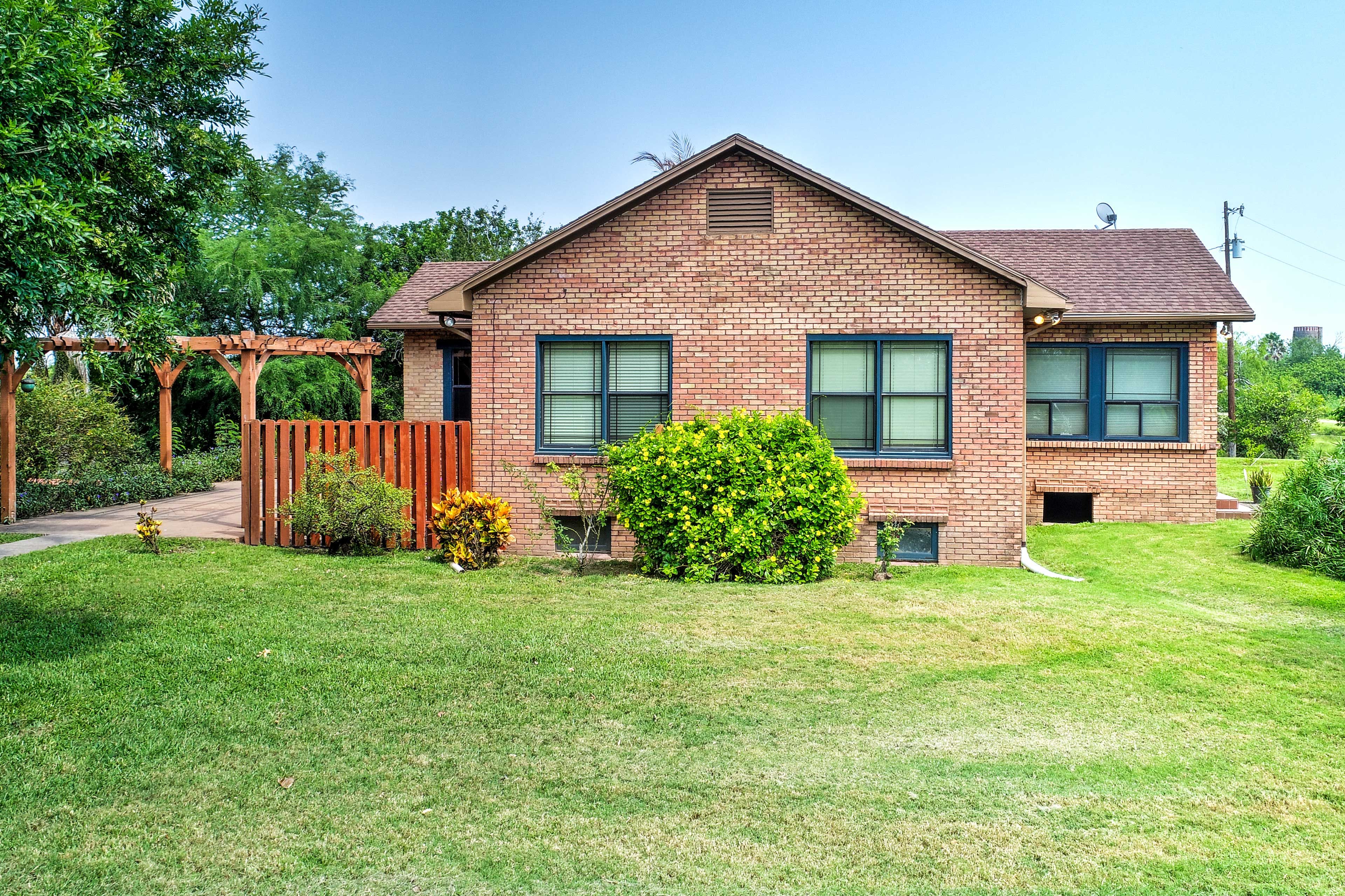 Verdant greenery surrounds this charming property.