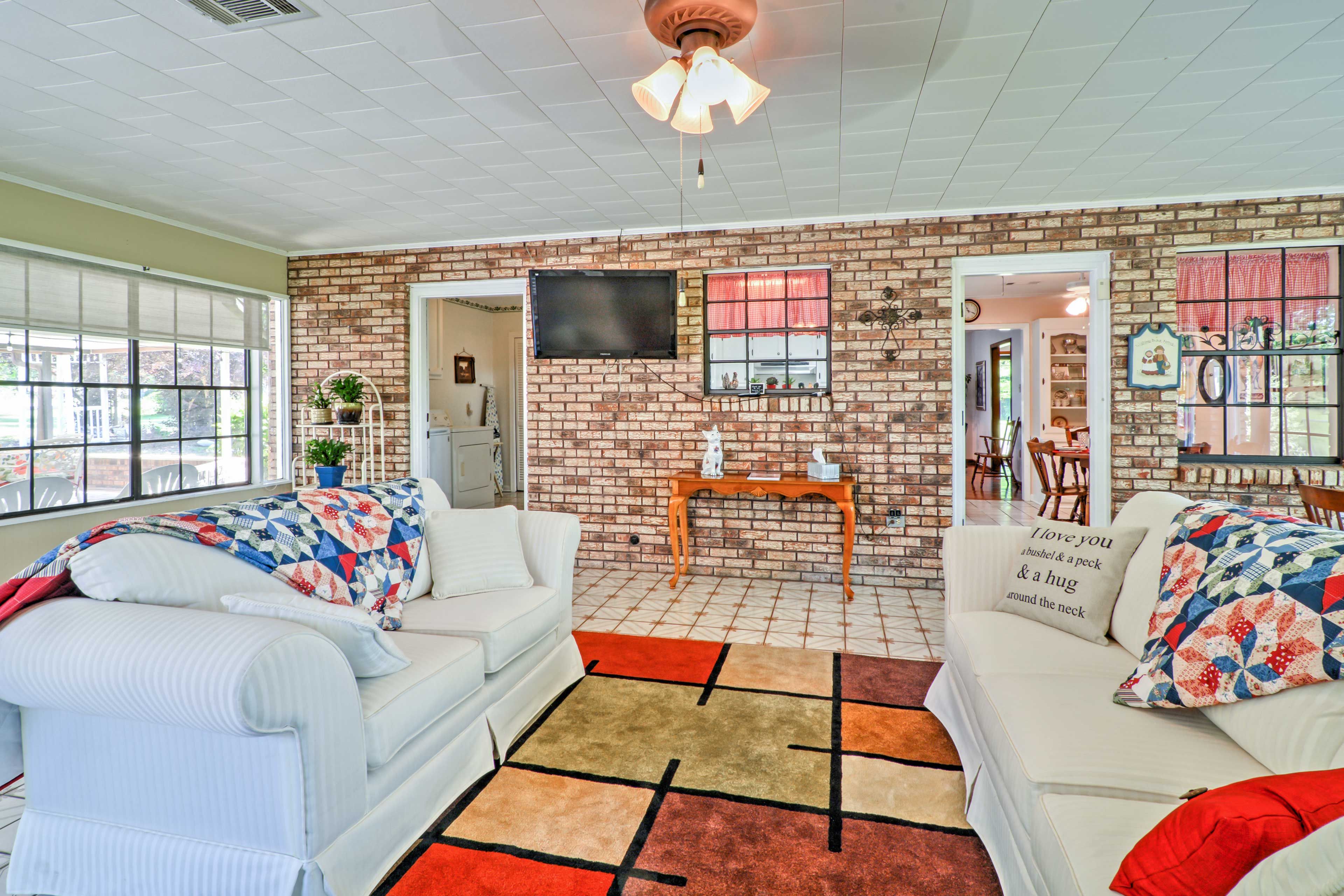 Everyone has a seat in the sunroom.