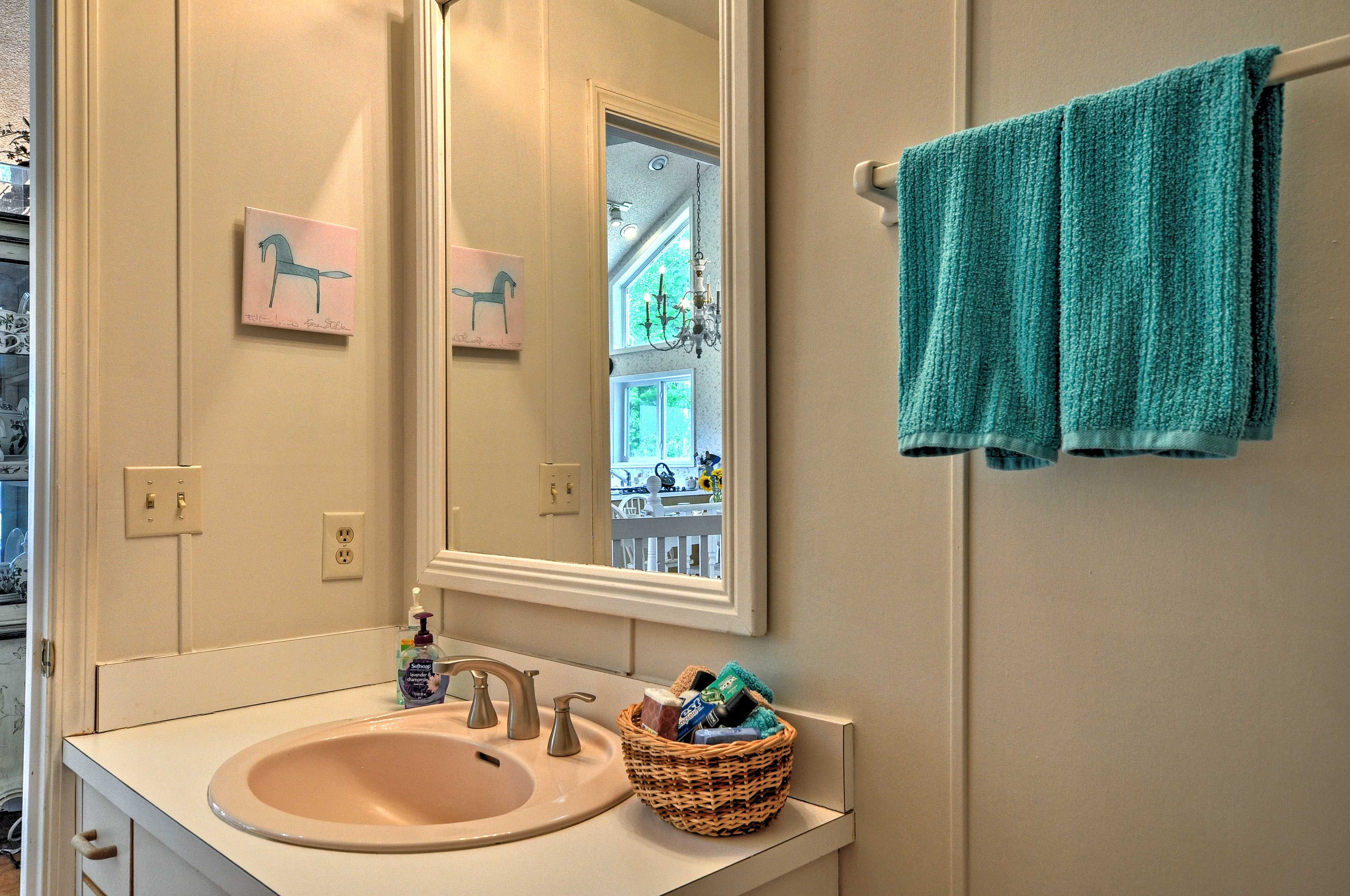 This half bath has a single vanity and a toilet.
