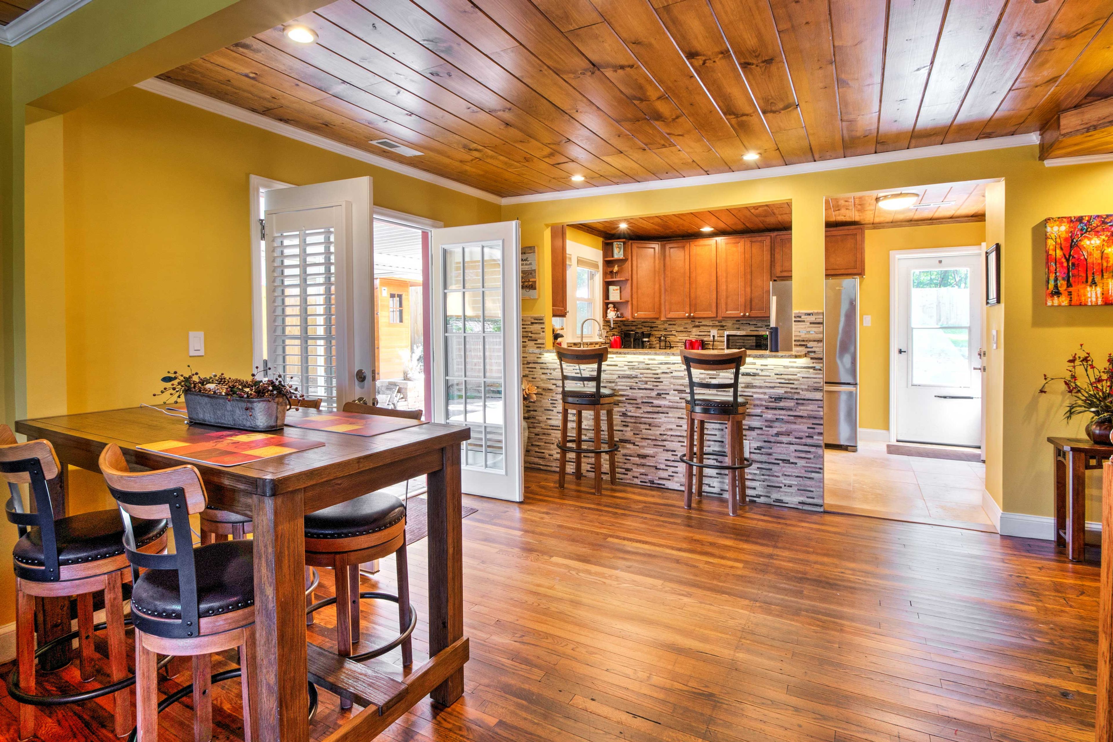 Open the large french doors that open to the covered patio for some fresh air and natural light.