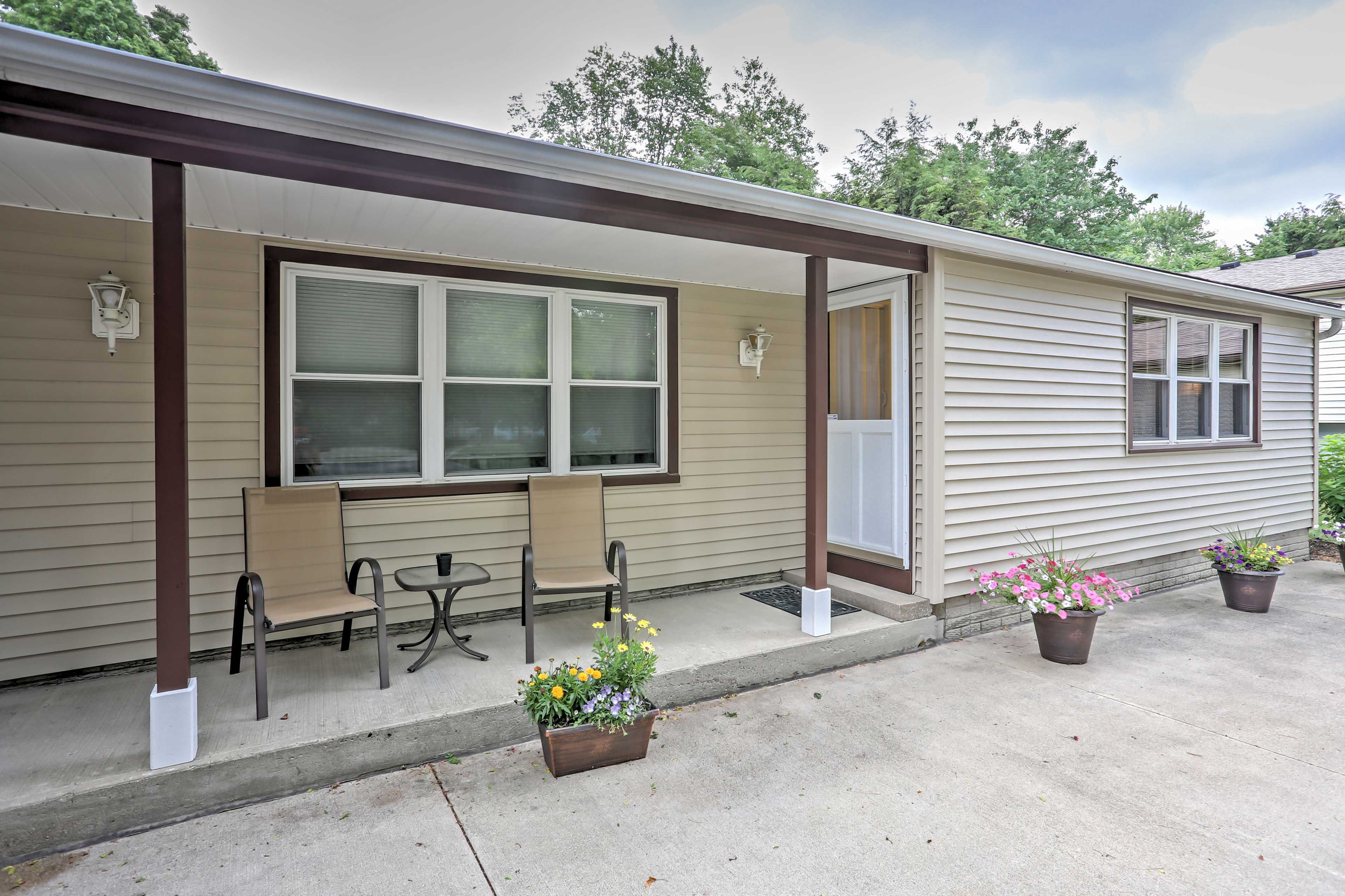The covered front porch is ideal for relaxing in any weather.