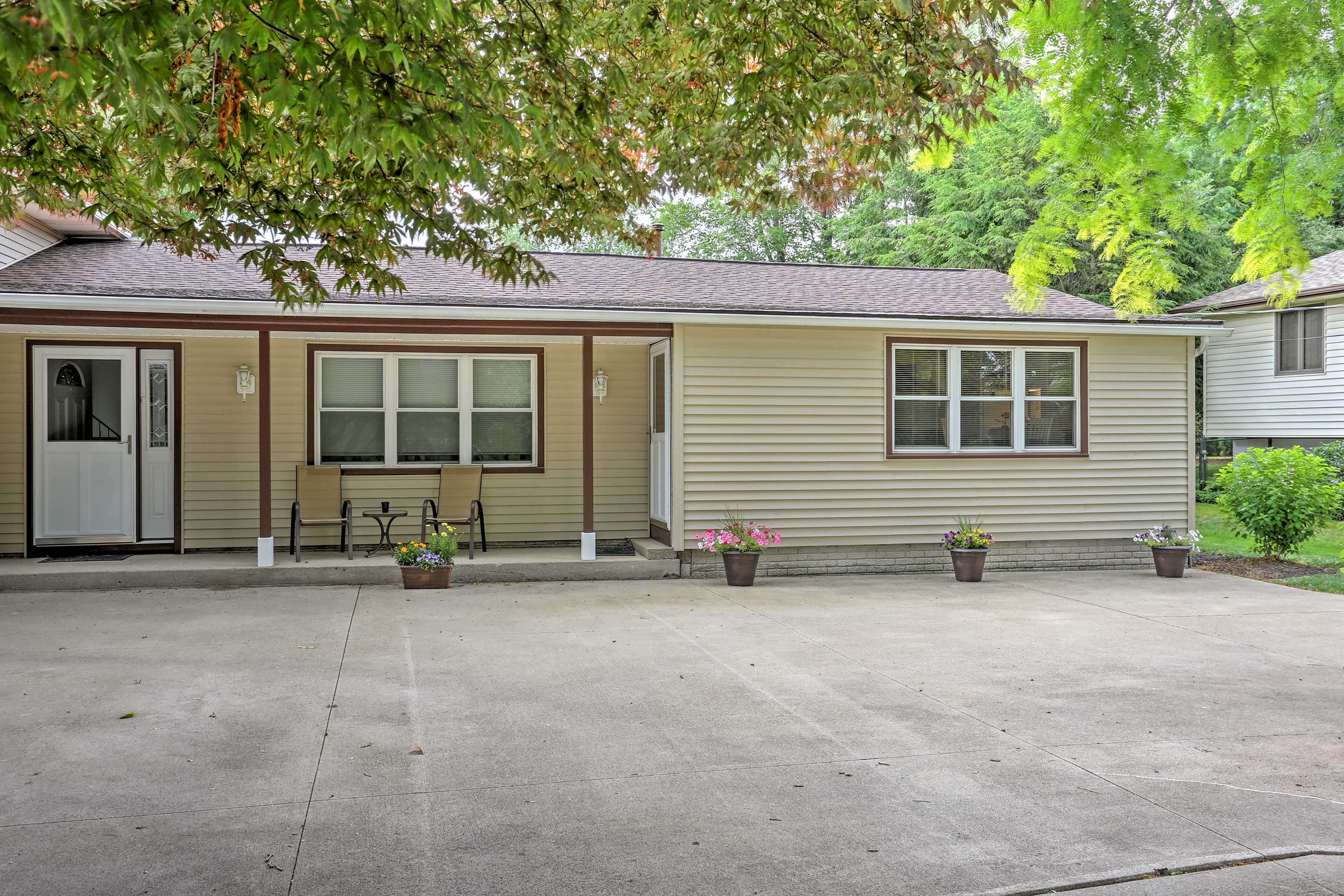 Two cars can park in the driveway.