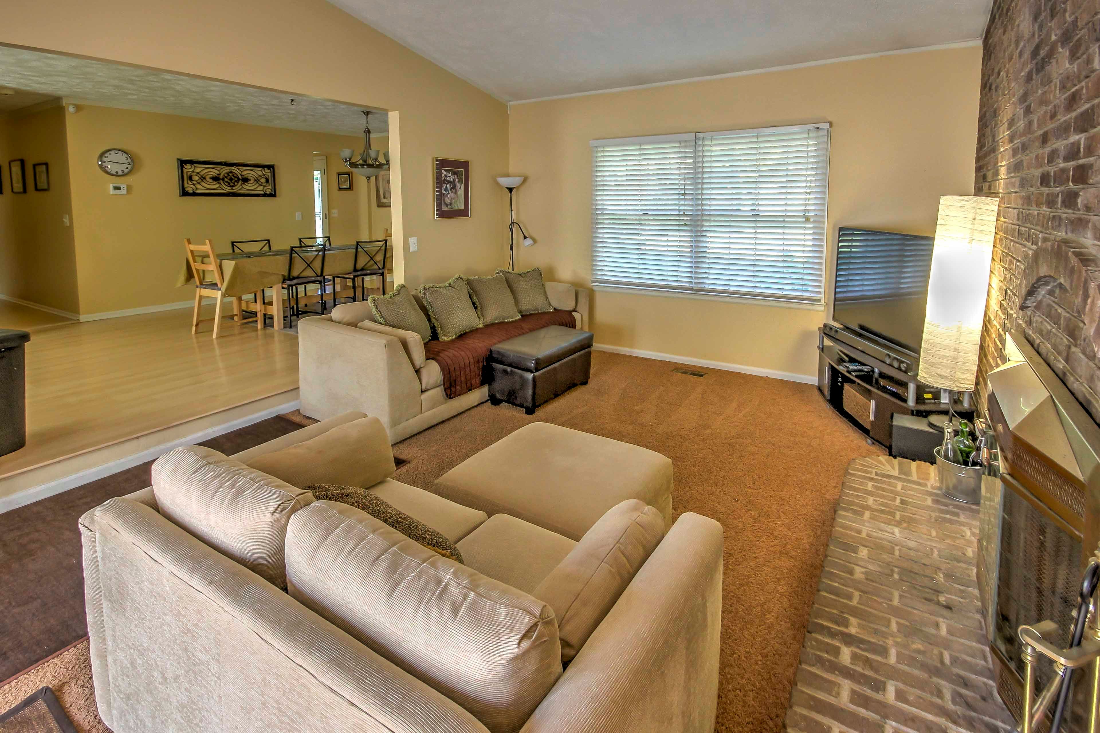 Step up from the living room into the adjacent kitchen and dining room.