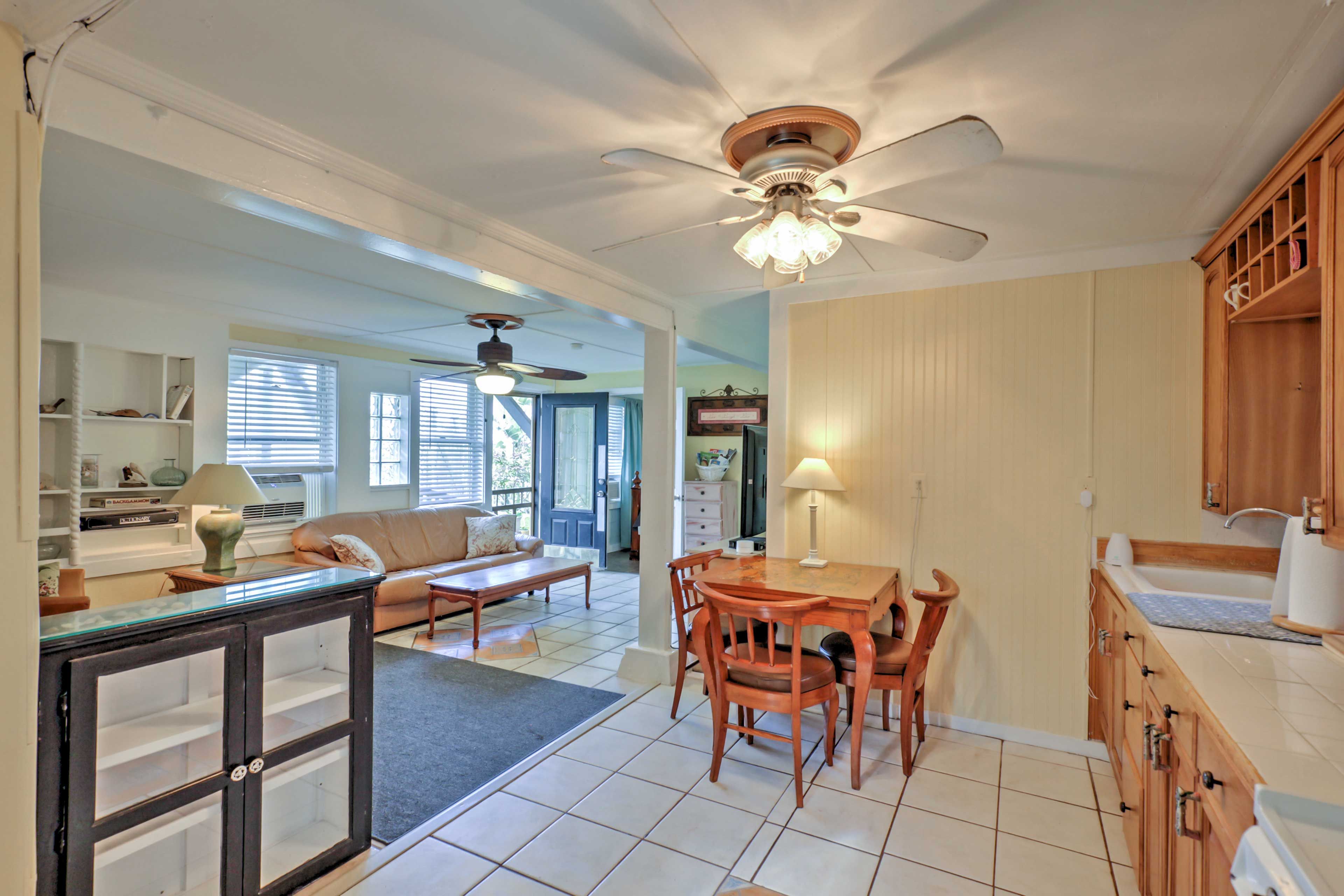 Gather around the charming dining table to enjoy your meals.