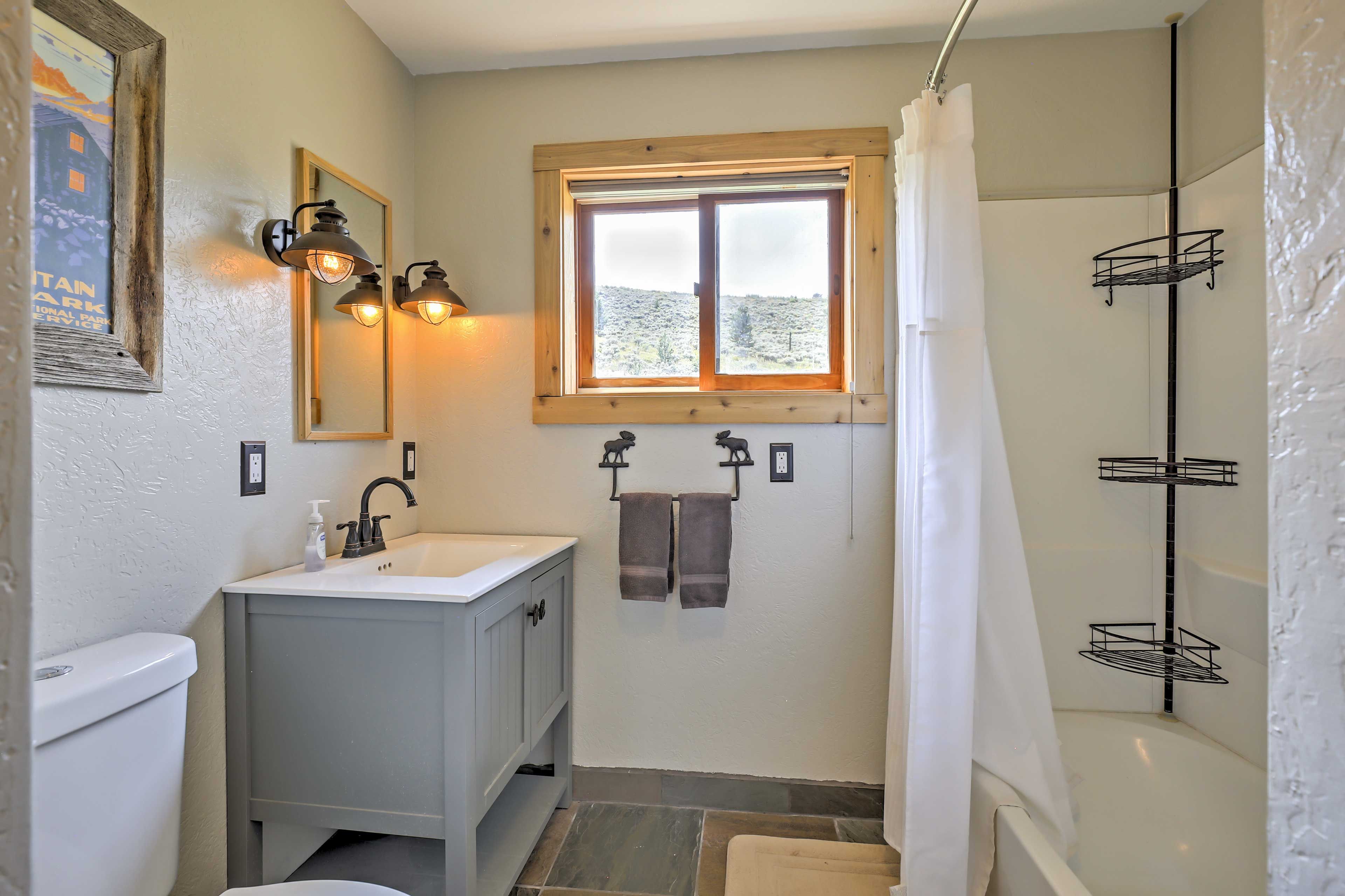 Rinse off in this pristine bathroom after an active day outdoors.