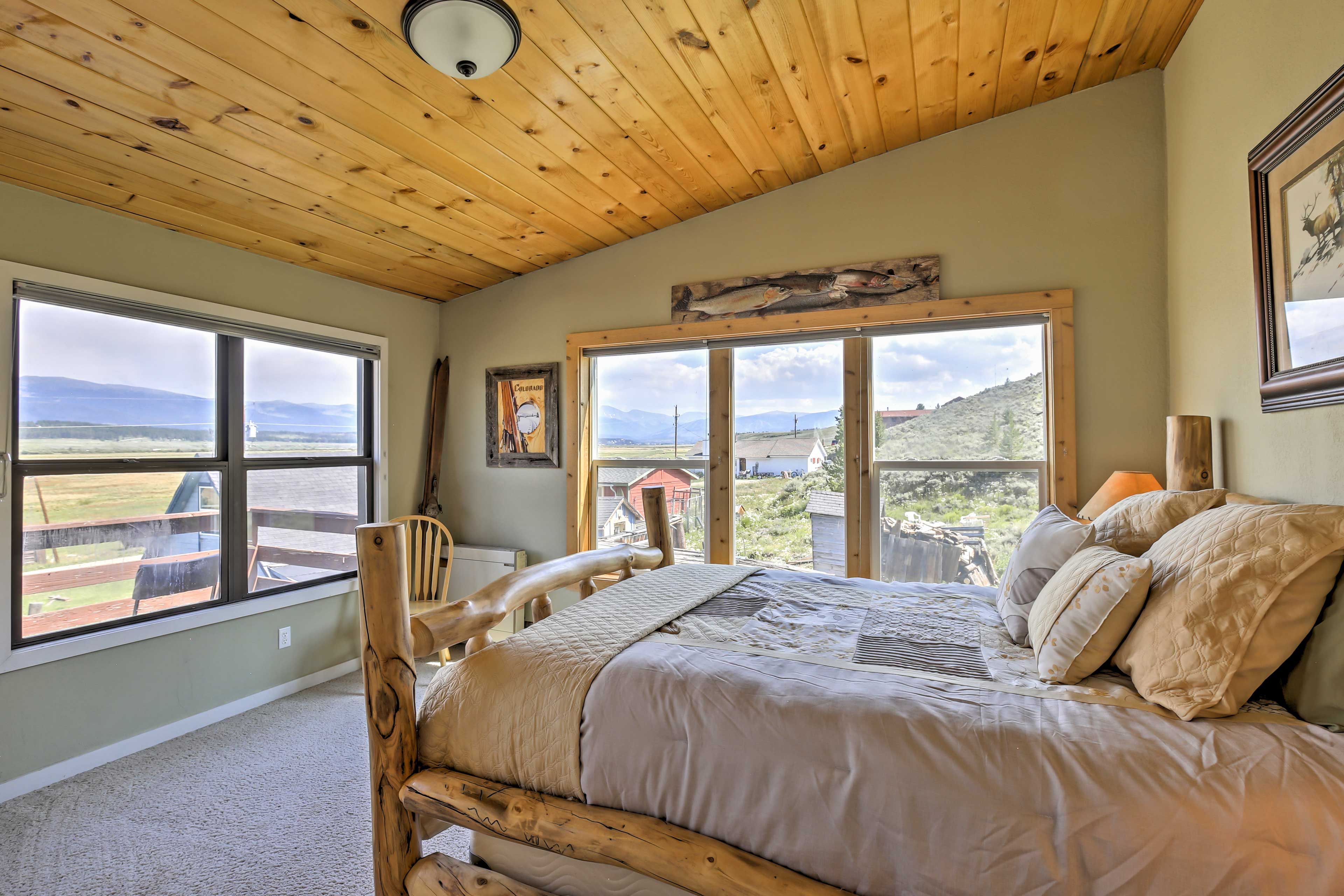 Bedroom 3 offers guests a queen mattress, rustic furnishings, and a view.