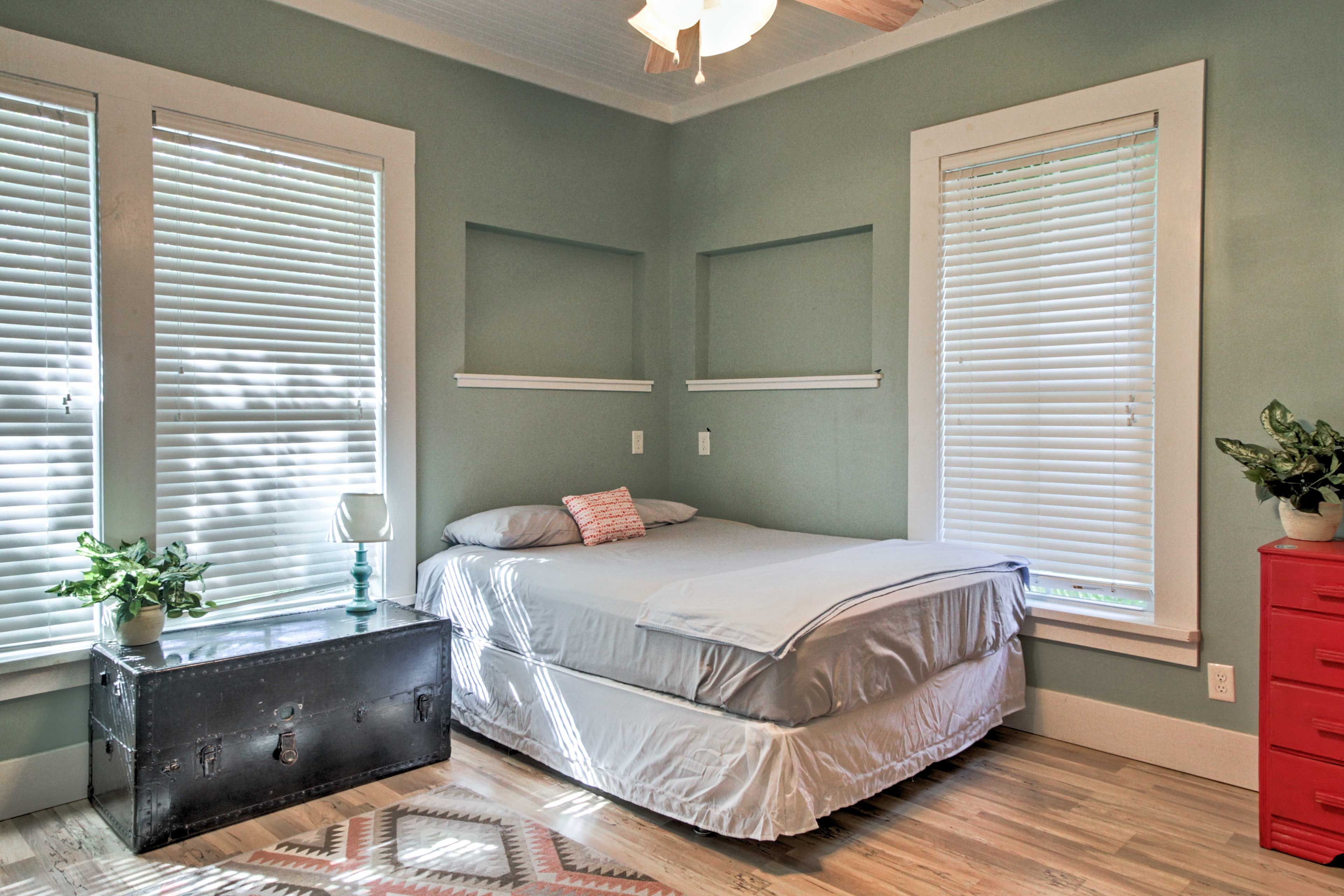 You'll feel right at home in this light and airy bedroom with a plush queen bed.