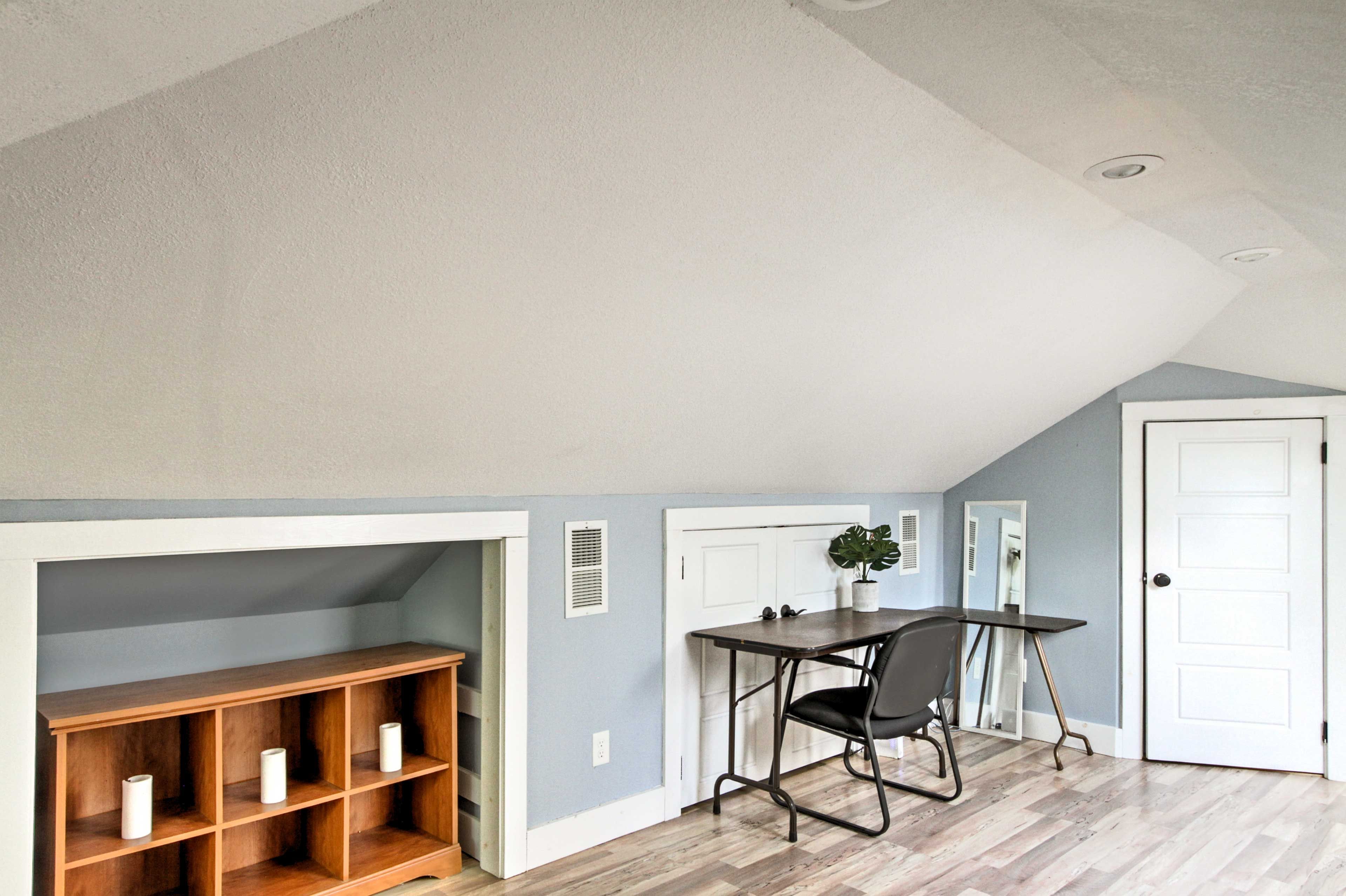 Catch up on work while seated at the desk.