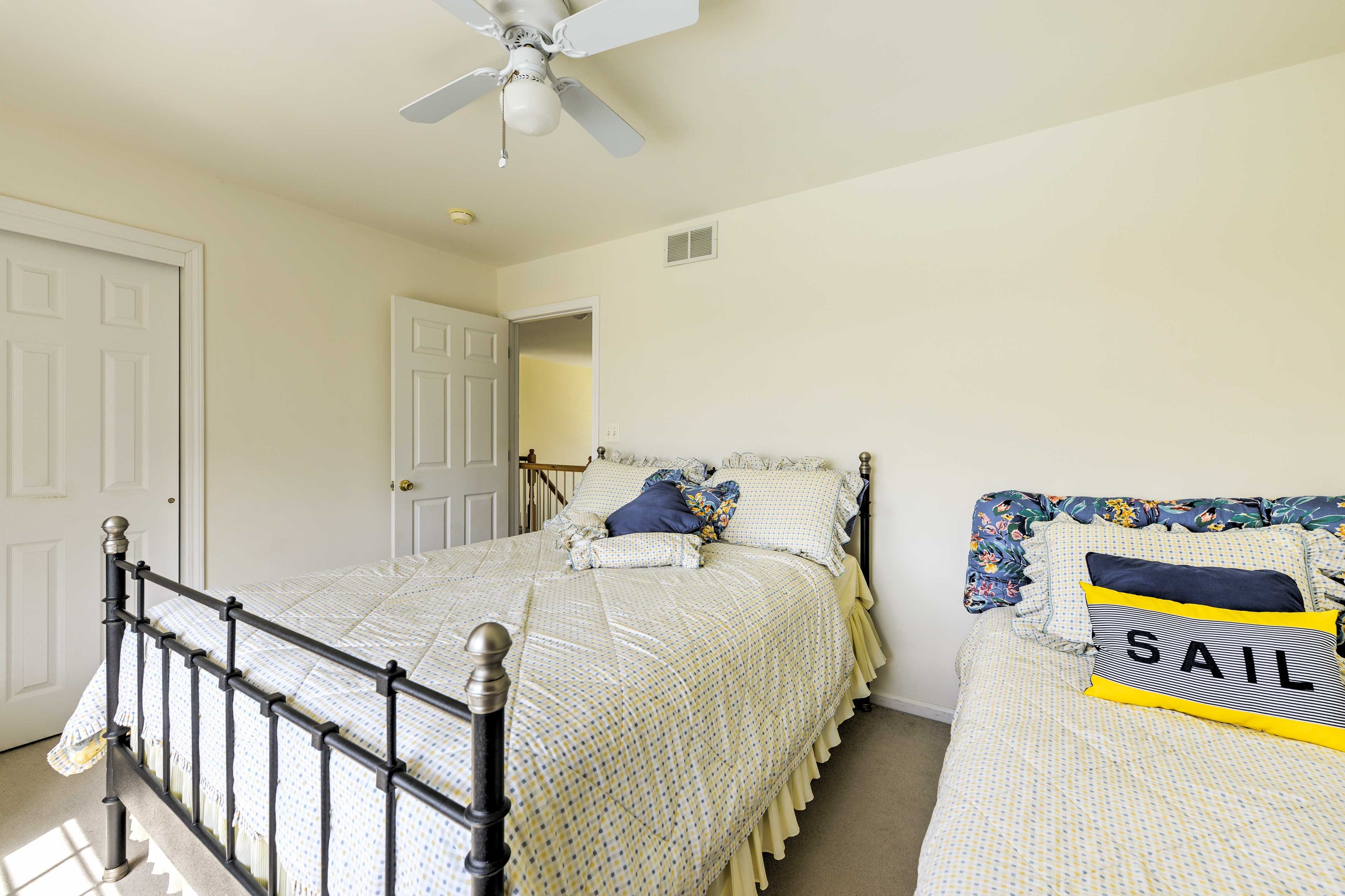 Two of the bedrooms feature twin-sized beds for ample sleeping accommodations.