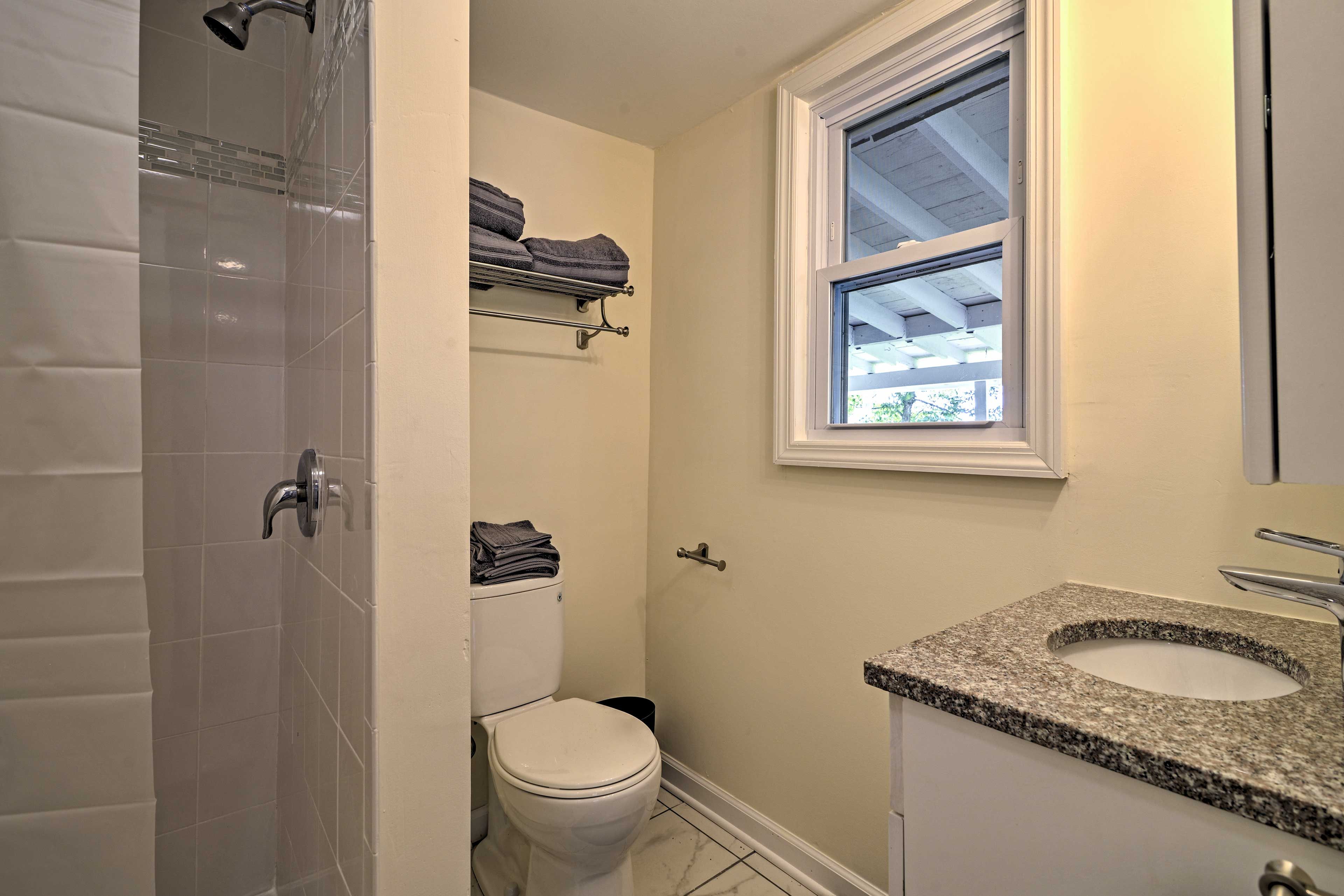 Freshen up in this tiled walk-in shower.