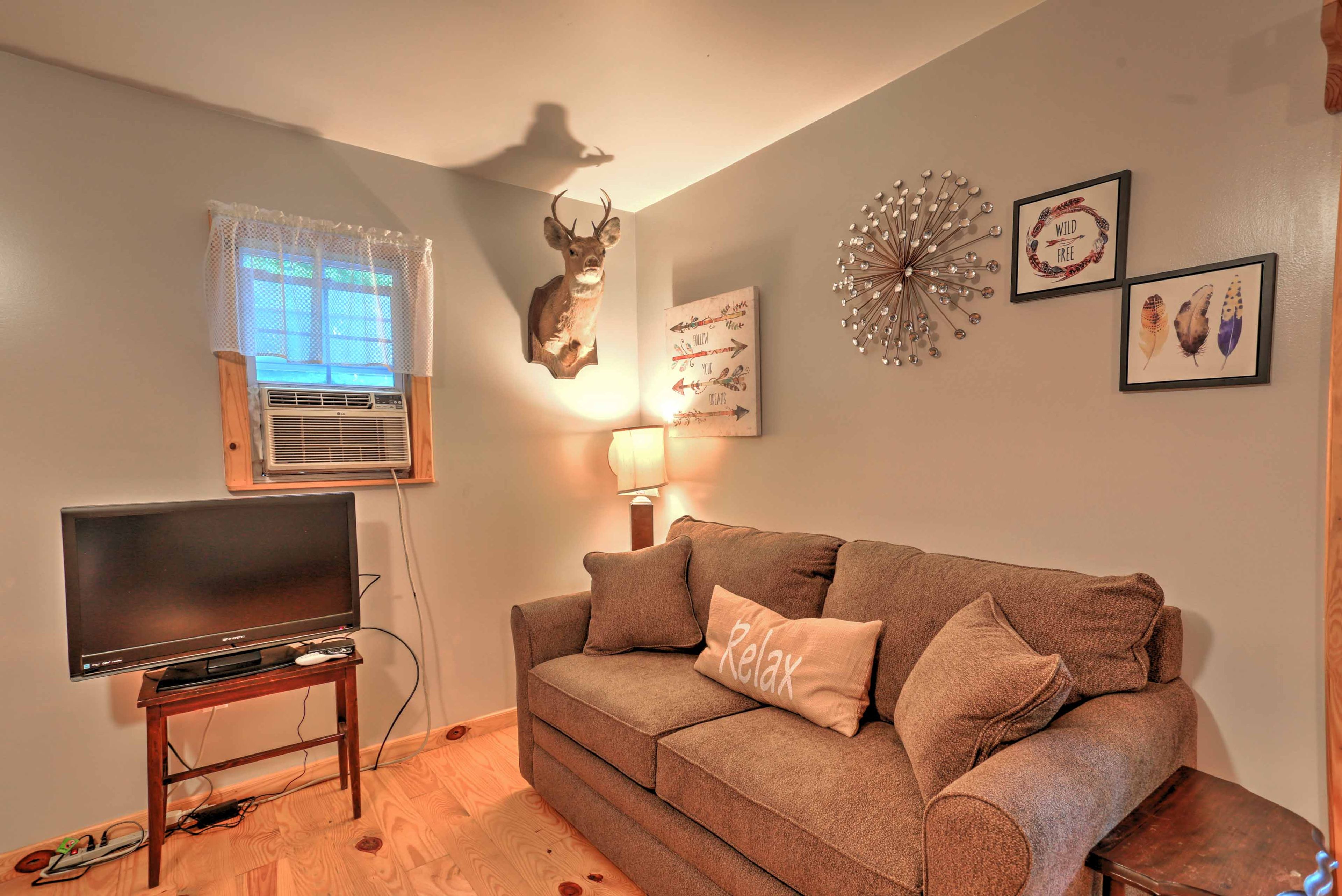 Two guests can sleep on the pullout bed in the living room.