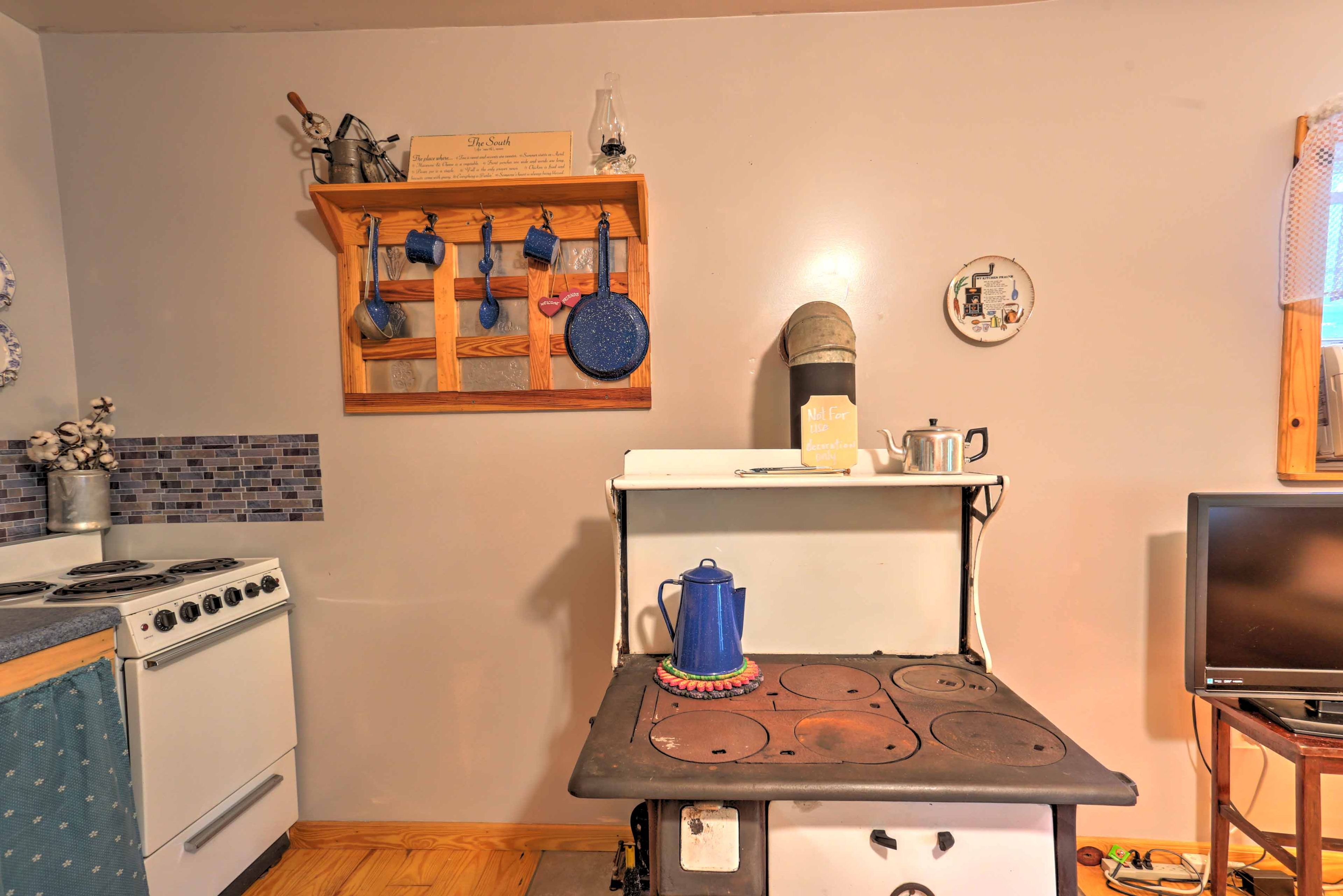 The home is filled with antiques, like this stove!
