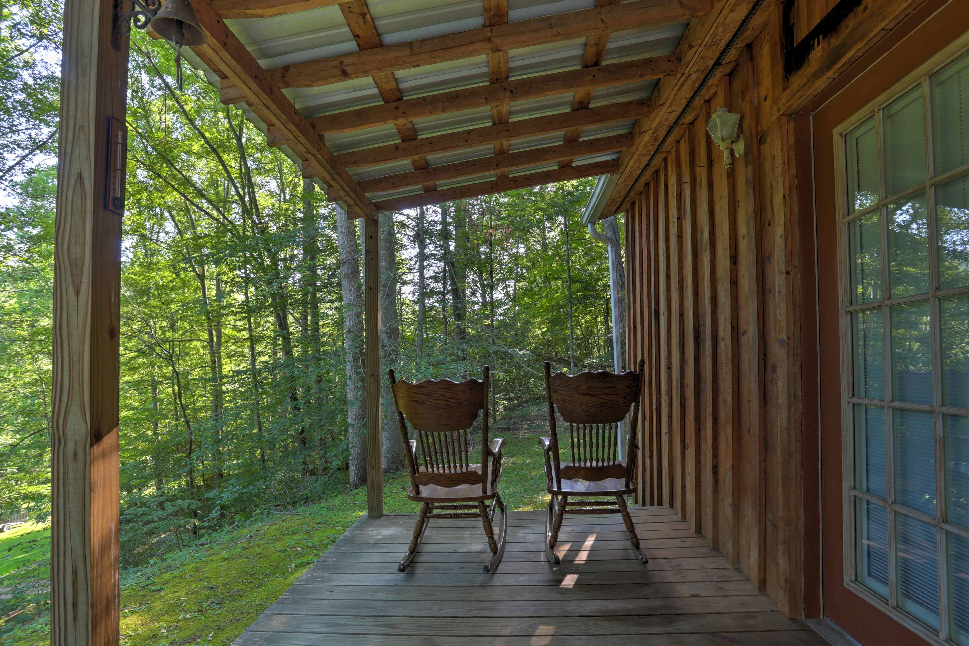 Enjoy your stay at the cabin while relaxing in the rocking chairs on the porch.