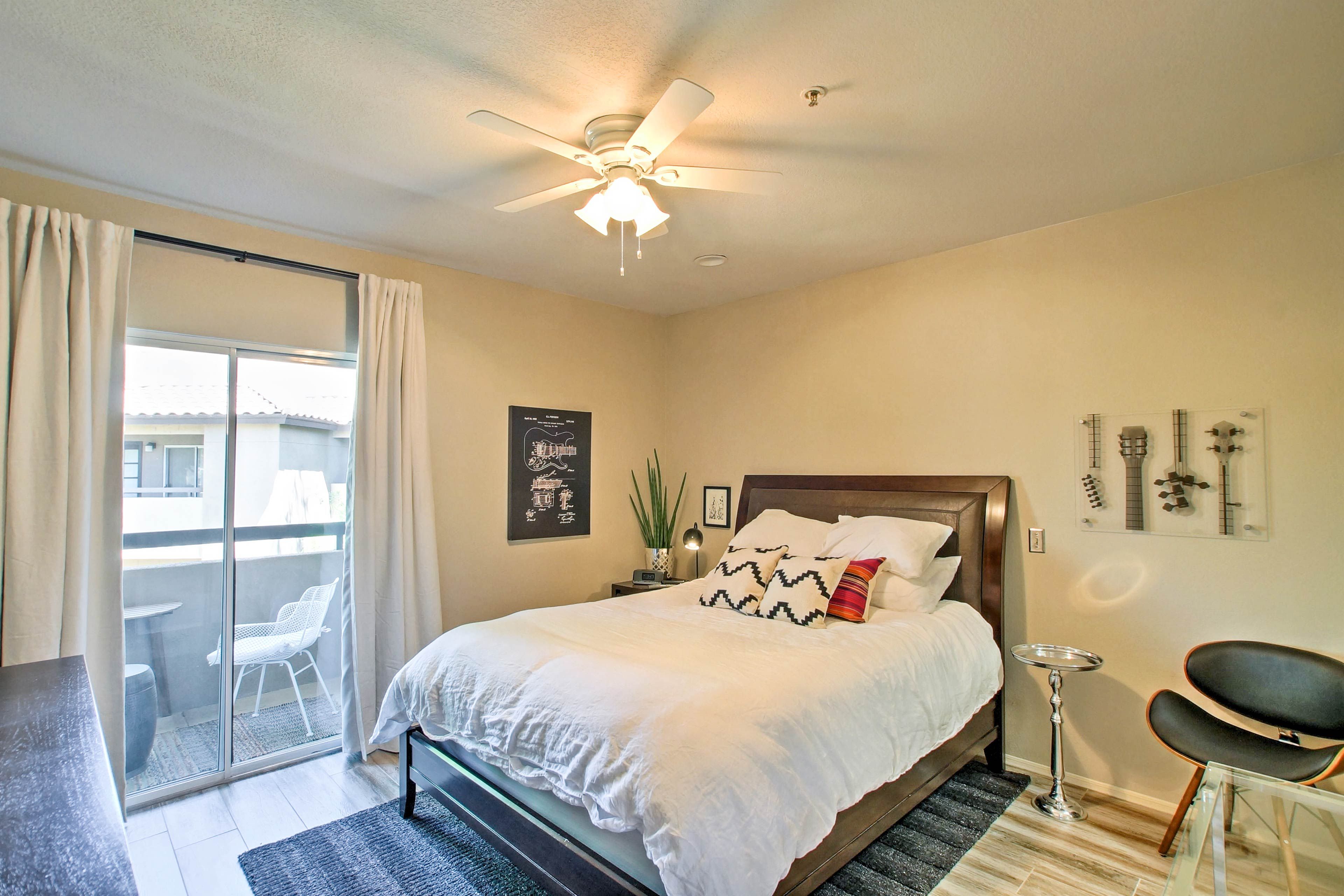 The bedroom features a plush queen-sized bed.