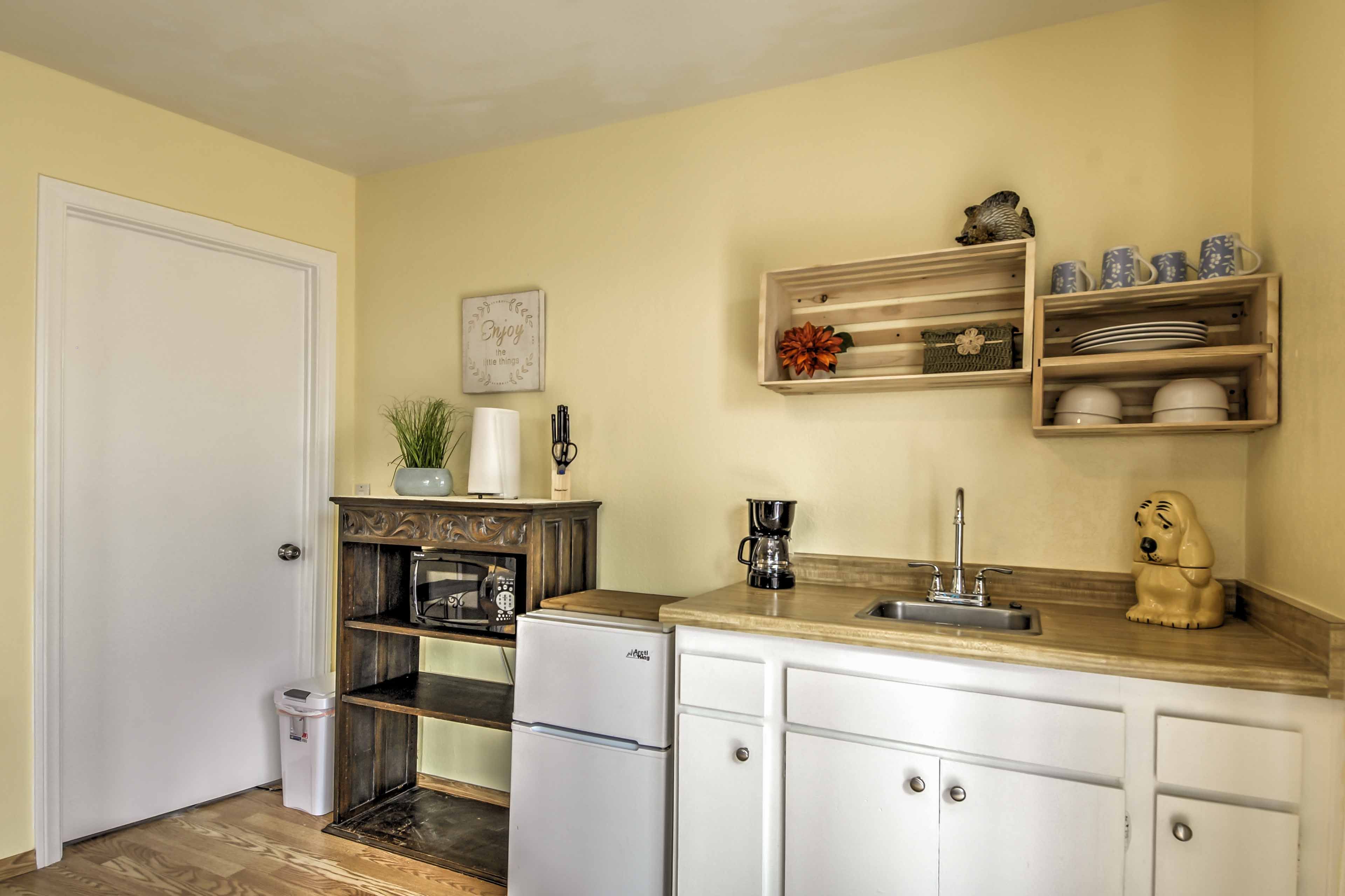 The kitchenette is equipped with a mini fridge and freezer, microwave, coffee maker and more!