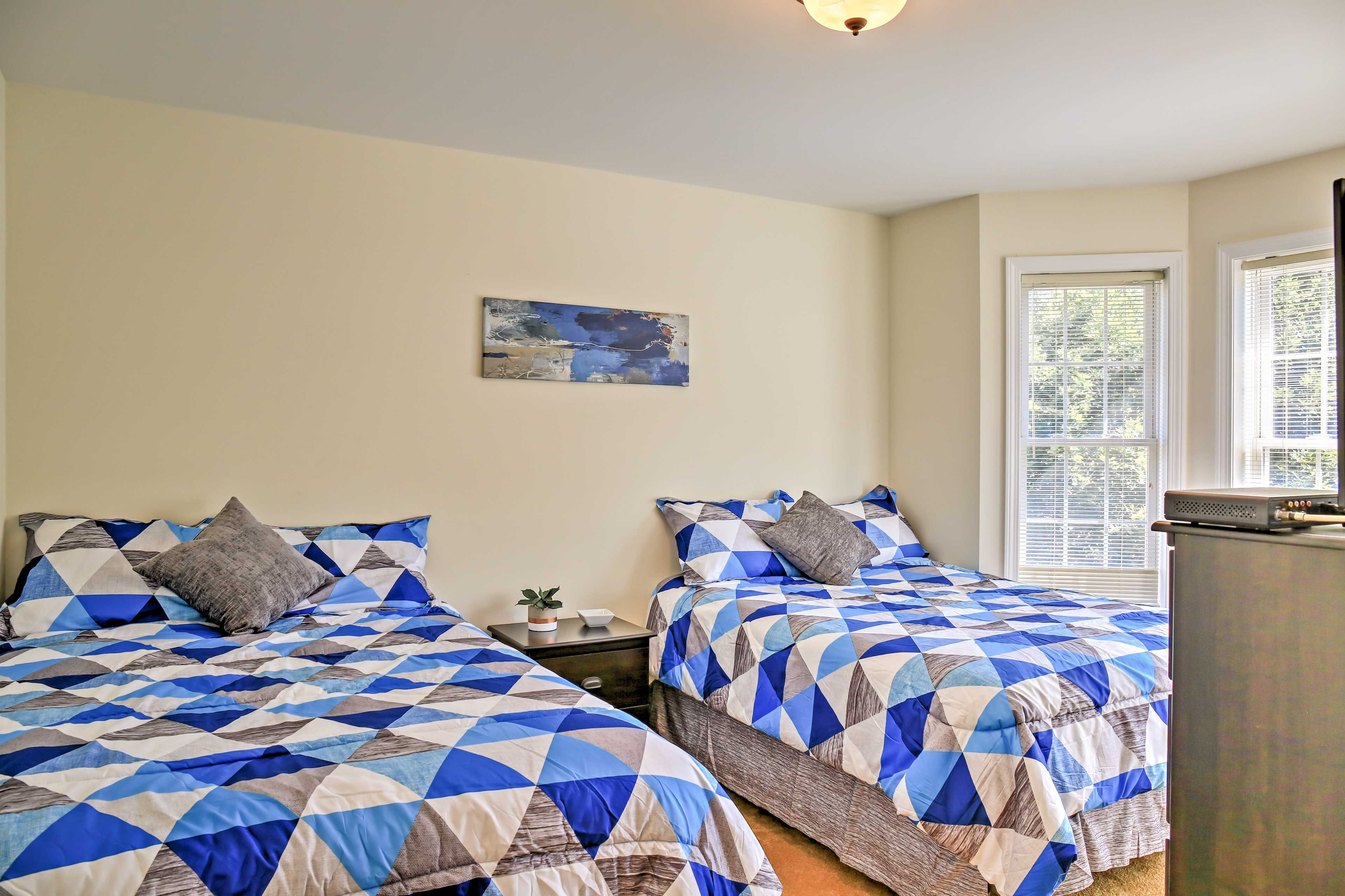 Two full beds can accommodate 4 guests.
