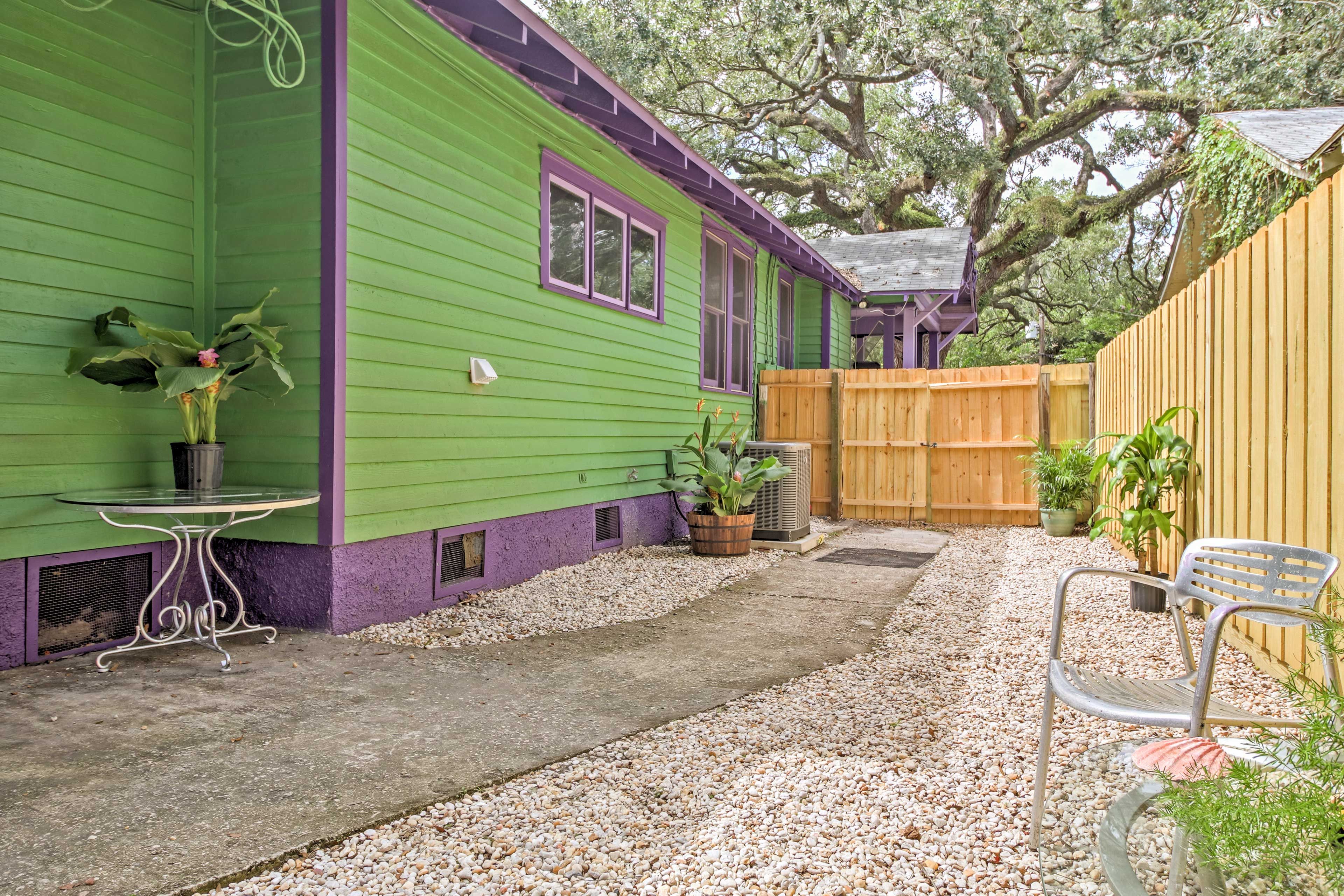The historic home has a large, fenced-in backyard.