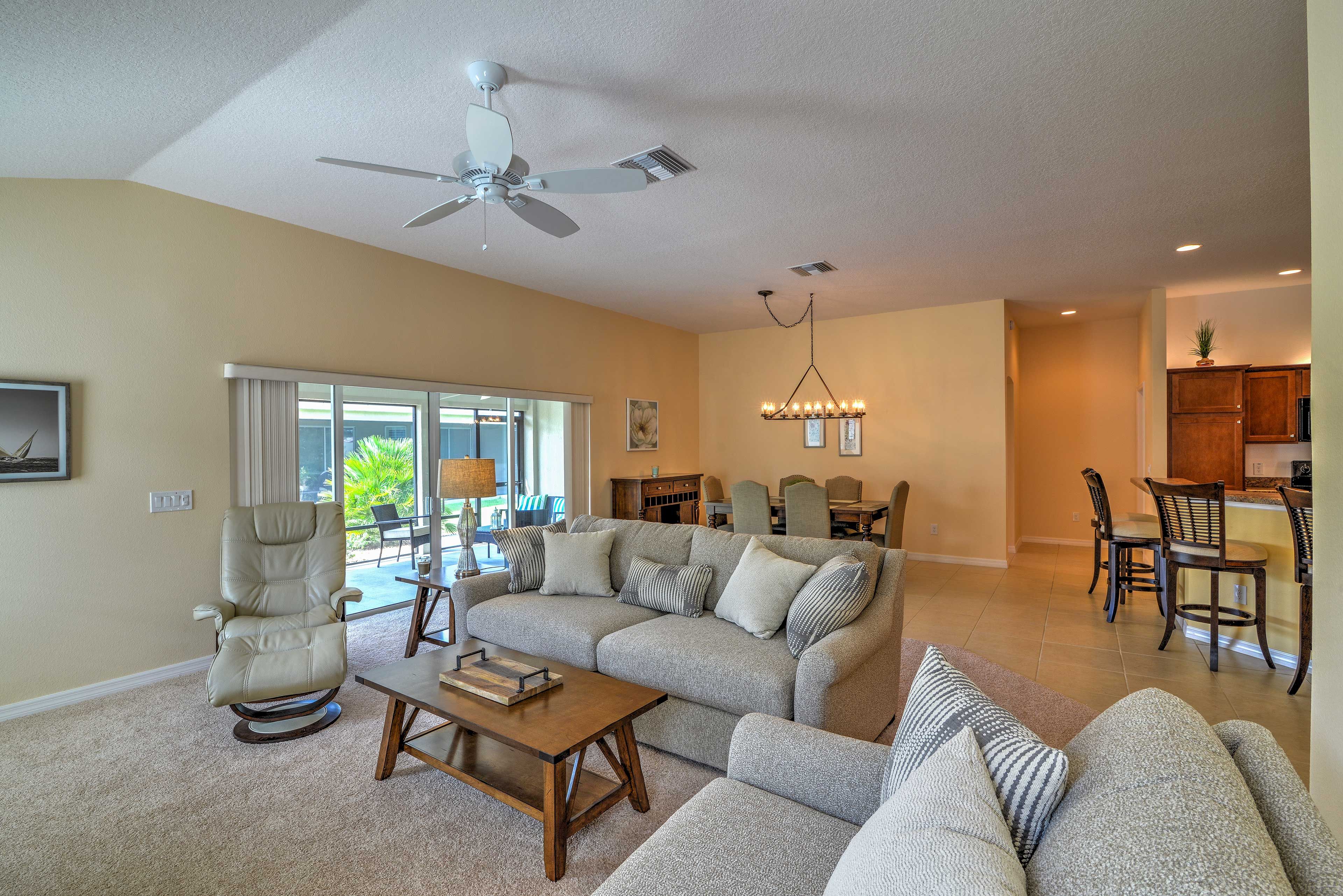 Gather in the living room, with ample seating and a large flat-screen cable TV.