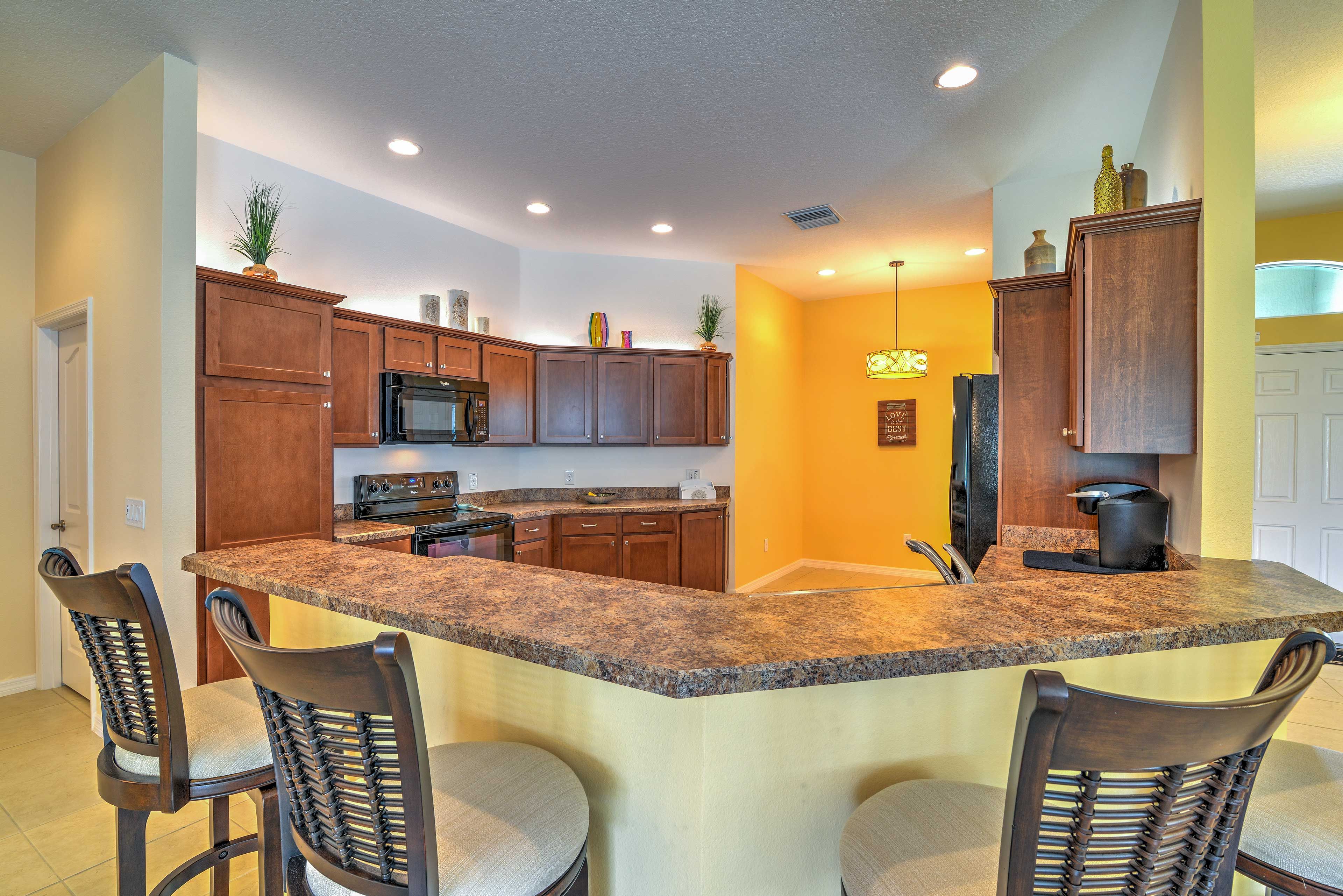 Perfect for enjoying a quick meal or snack, the breakfast bar has seating for 4.
