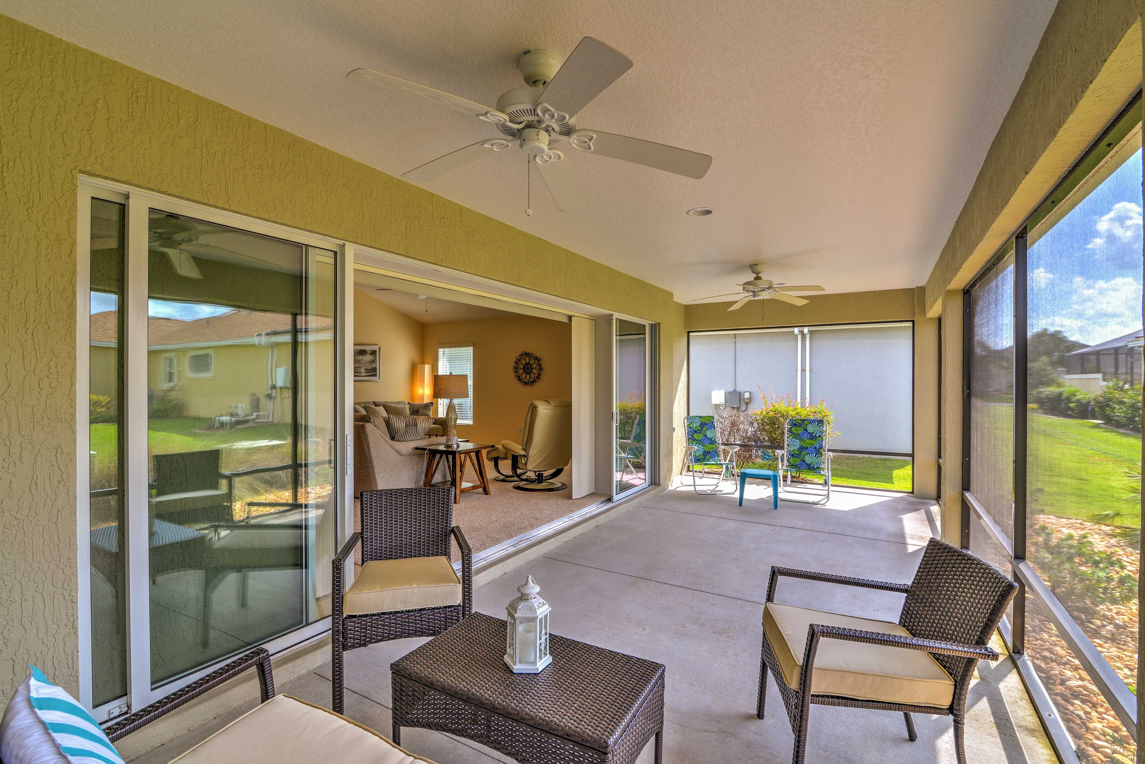 An extended lanai offers outdoor seating to enjoy a drink or simply relax