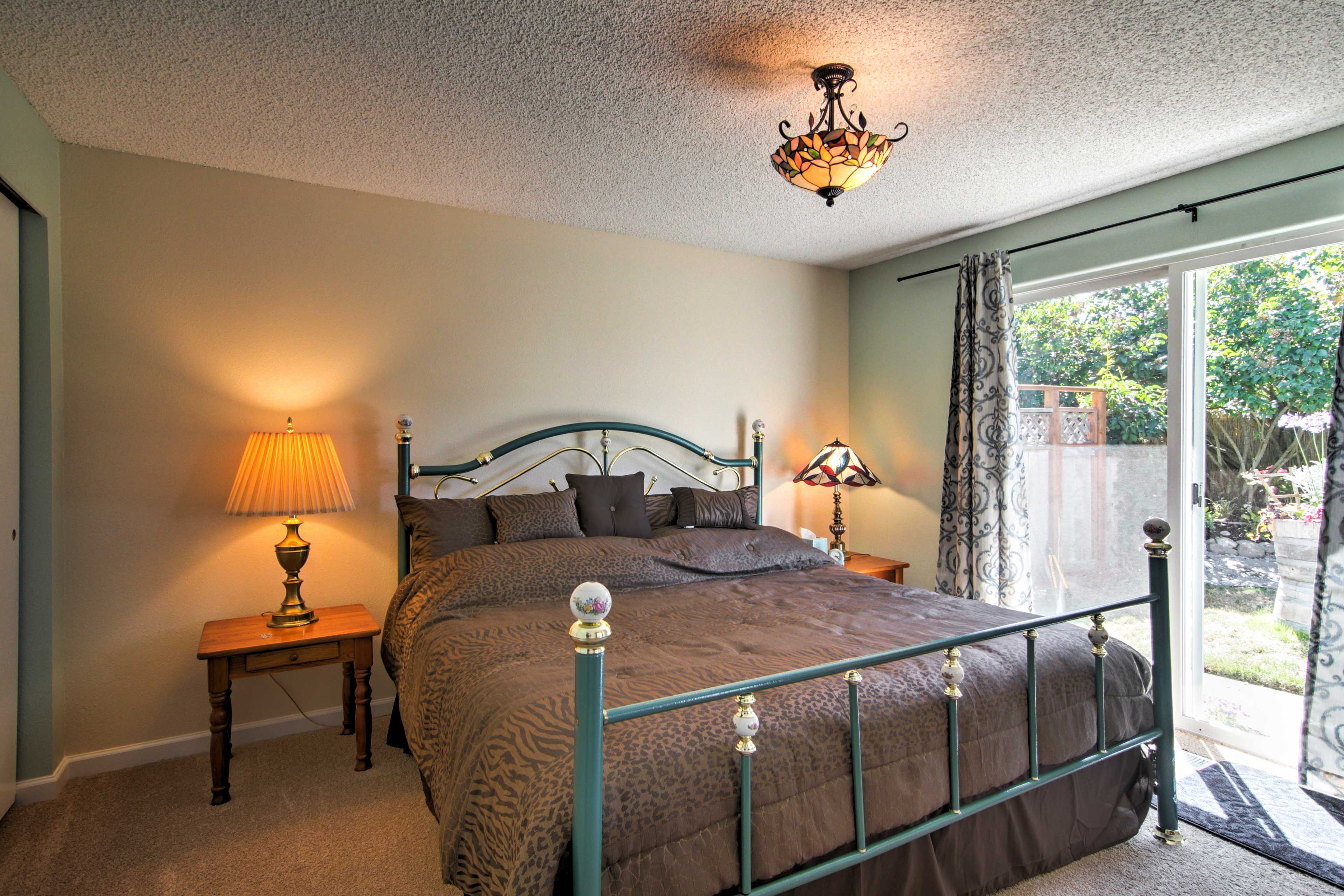 This bedroom contains a king-sized bed and direct courtyard access.