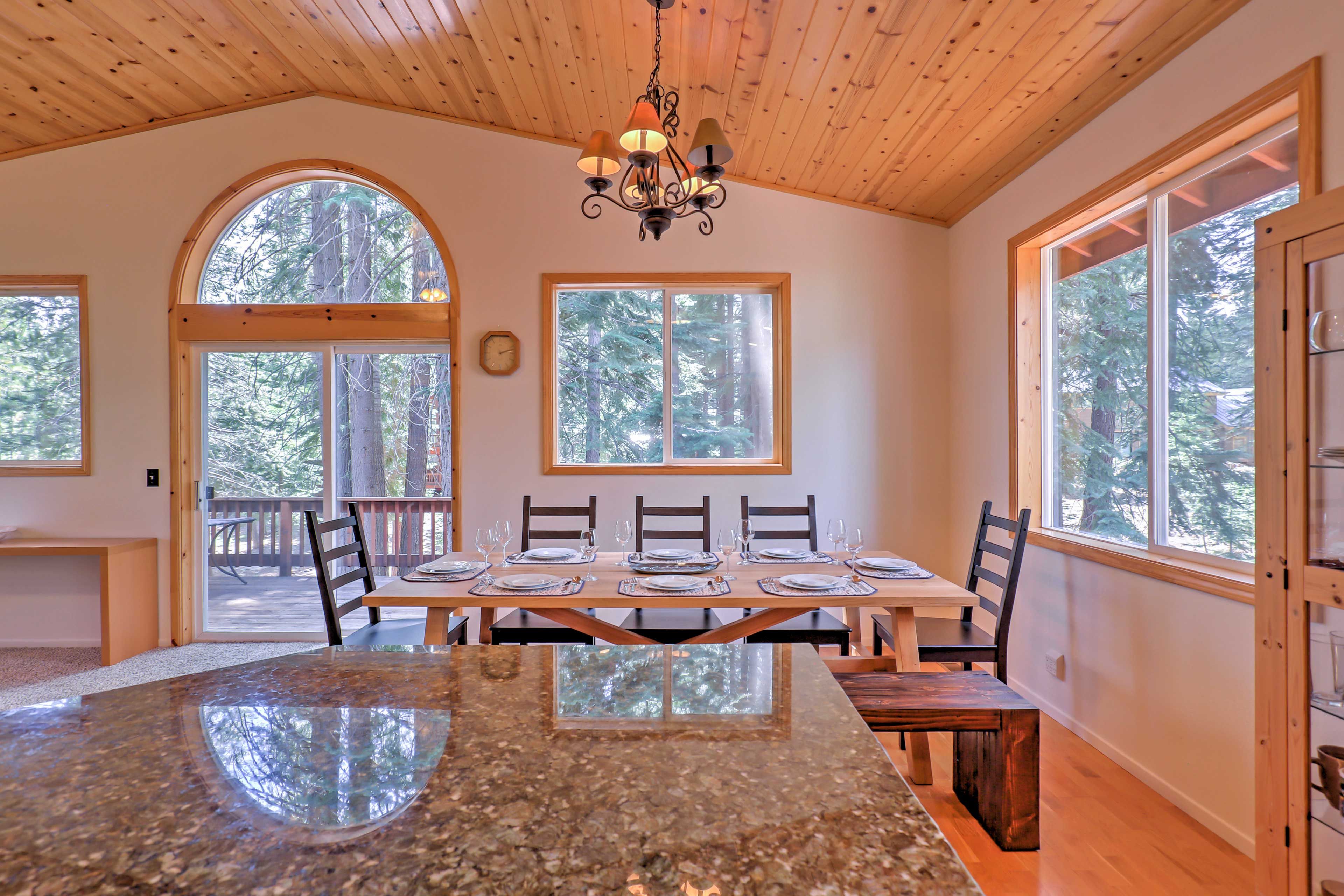 Settle down at the rustic dining table as views greet you through the windows.