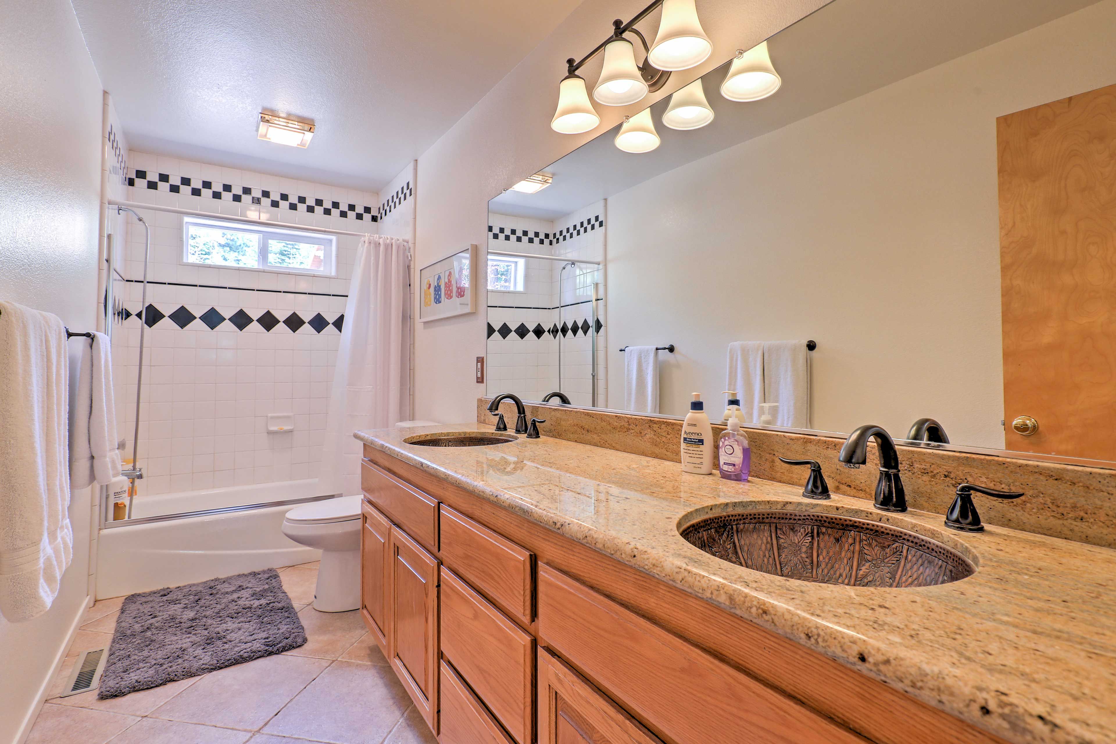 Freshen up for an exciting day ahead in the third bathroom.