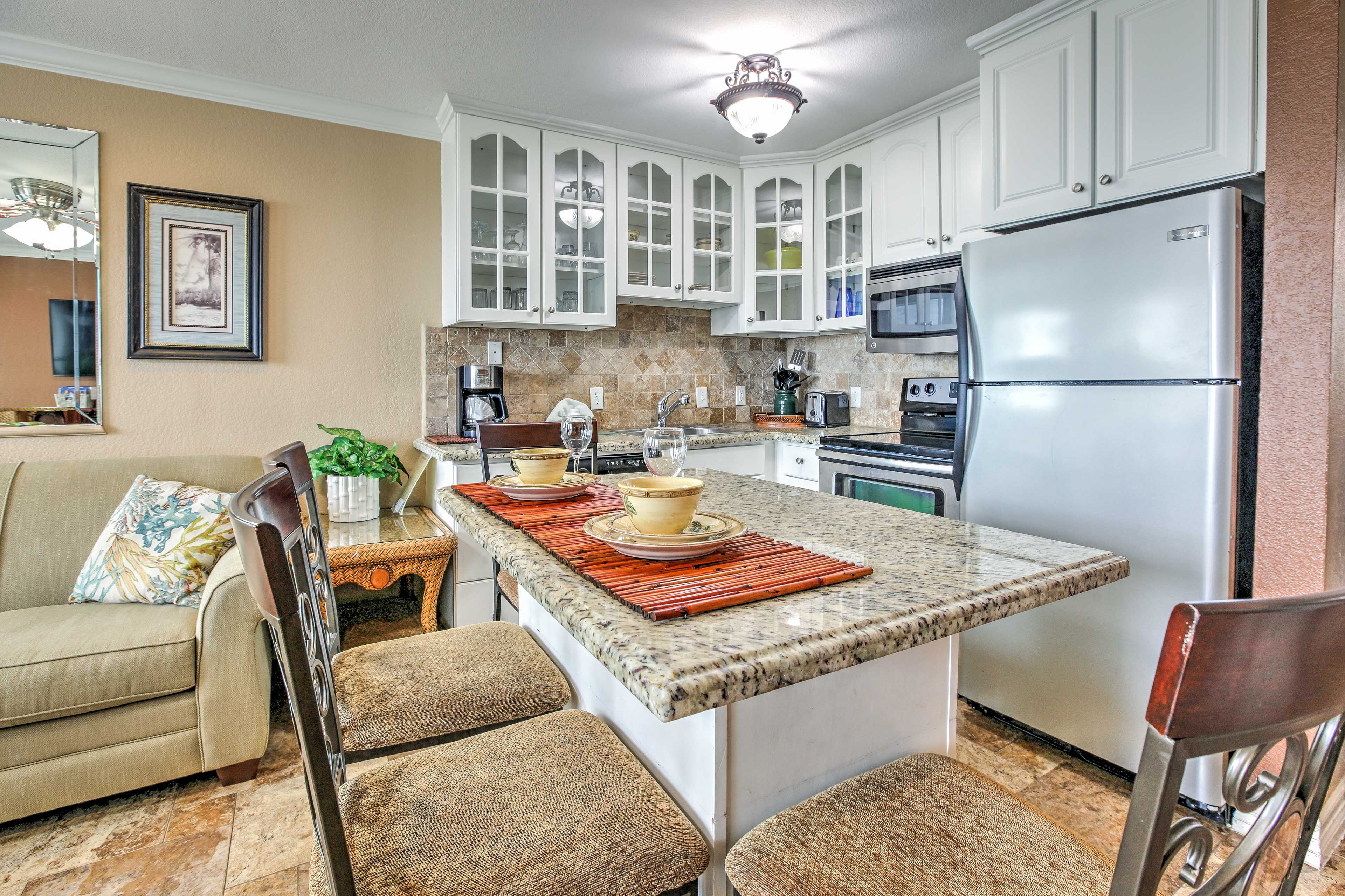 Take a seat at the island and watch the magic happen as the chef prepares gourmet meals in the fully equipped kitchen.