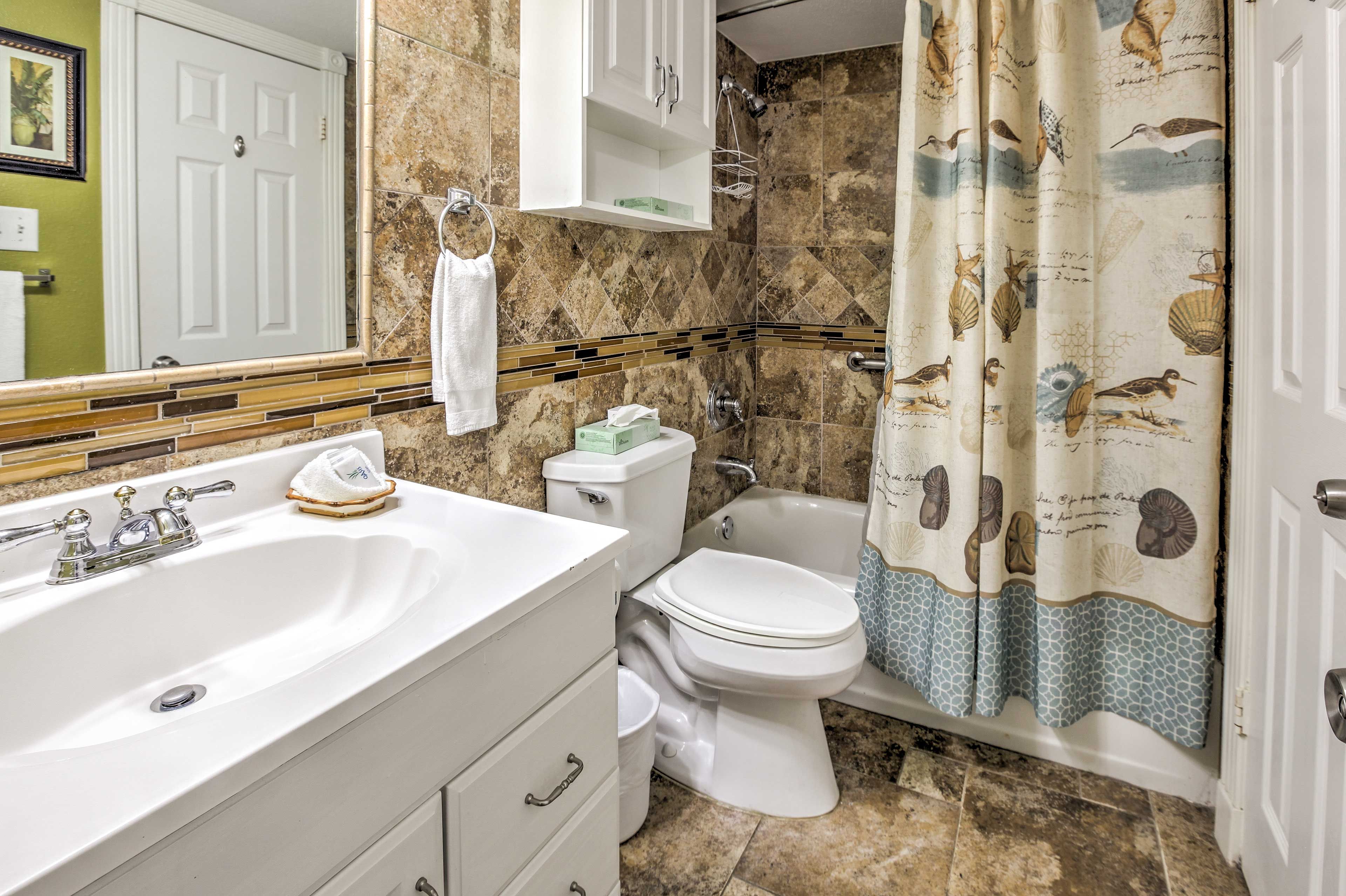The second bathroom offers a shower/tub combo.