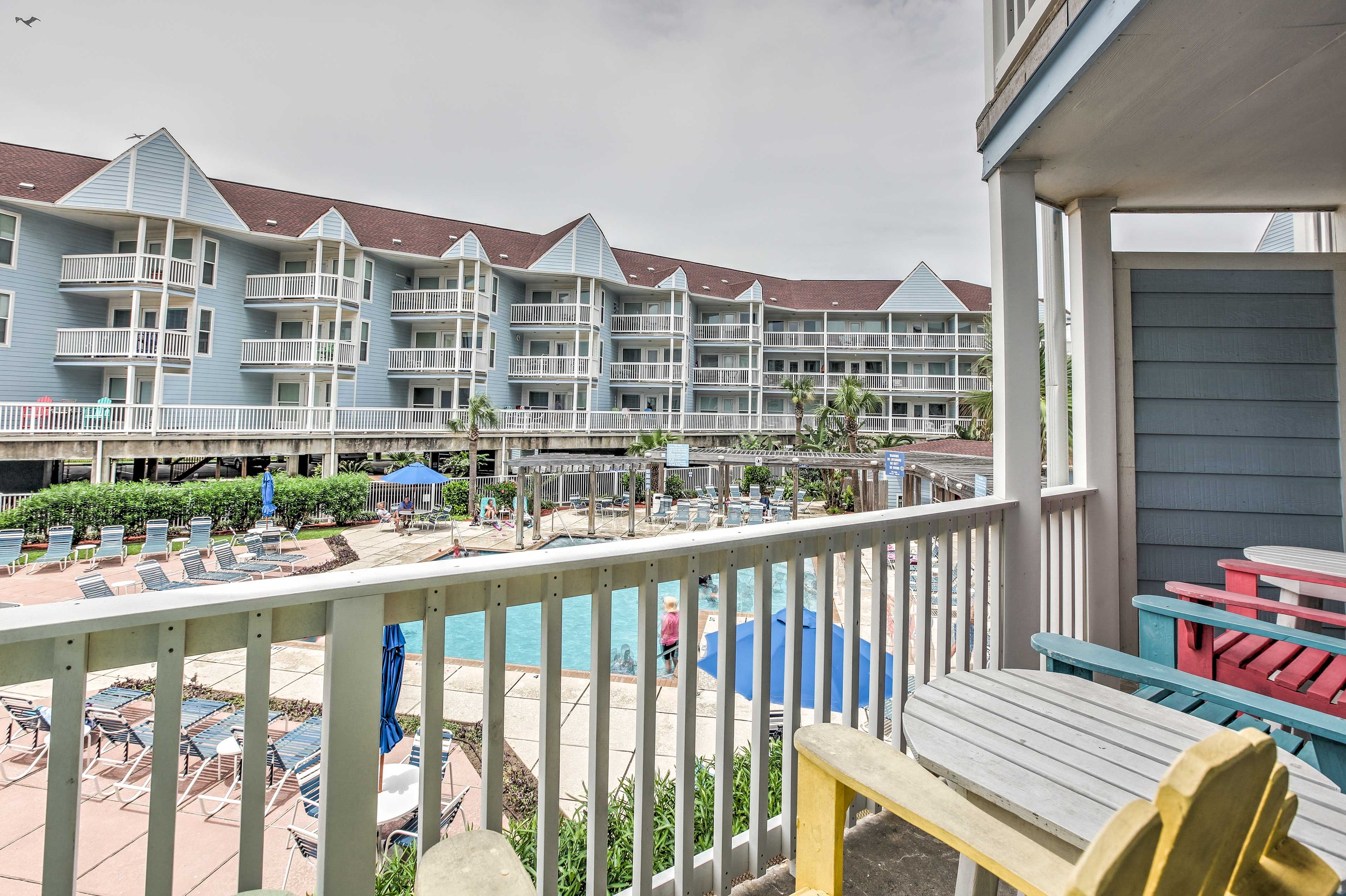 Scope out open lounge chairs by the pool from your private patio!