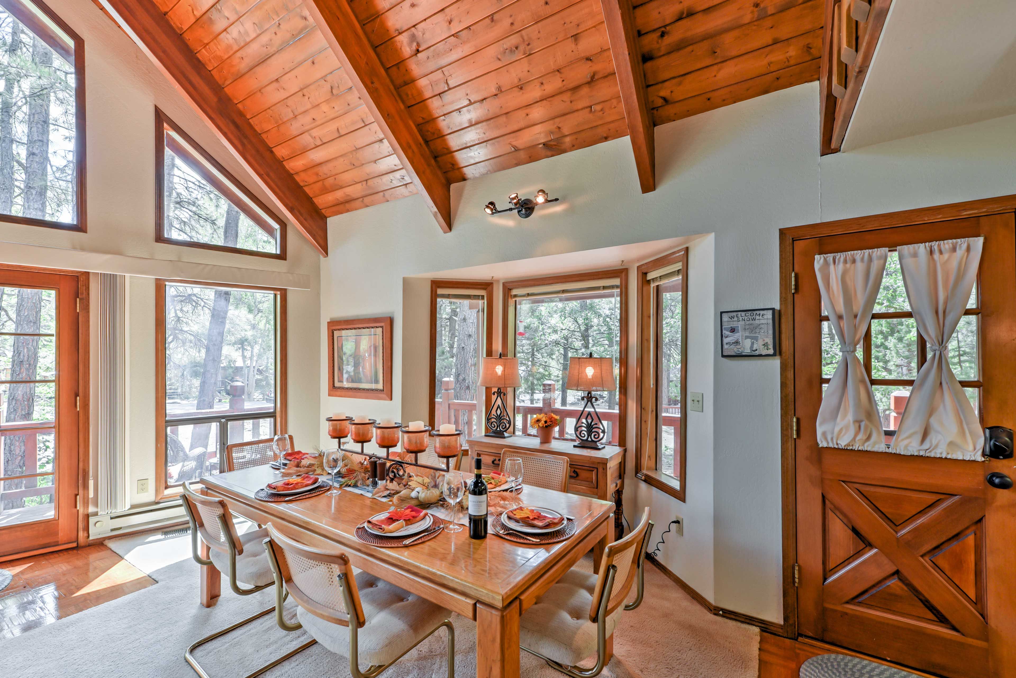 The dining area is open to the living room and features a wood table for 6.