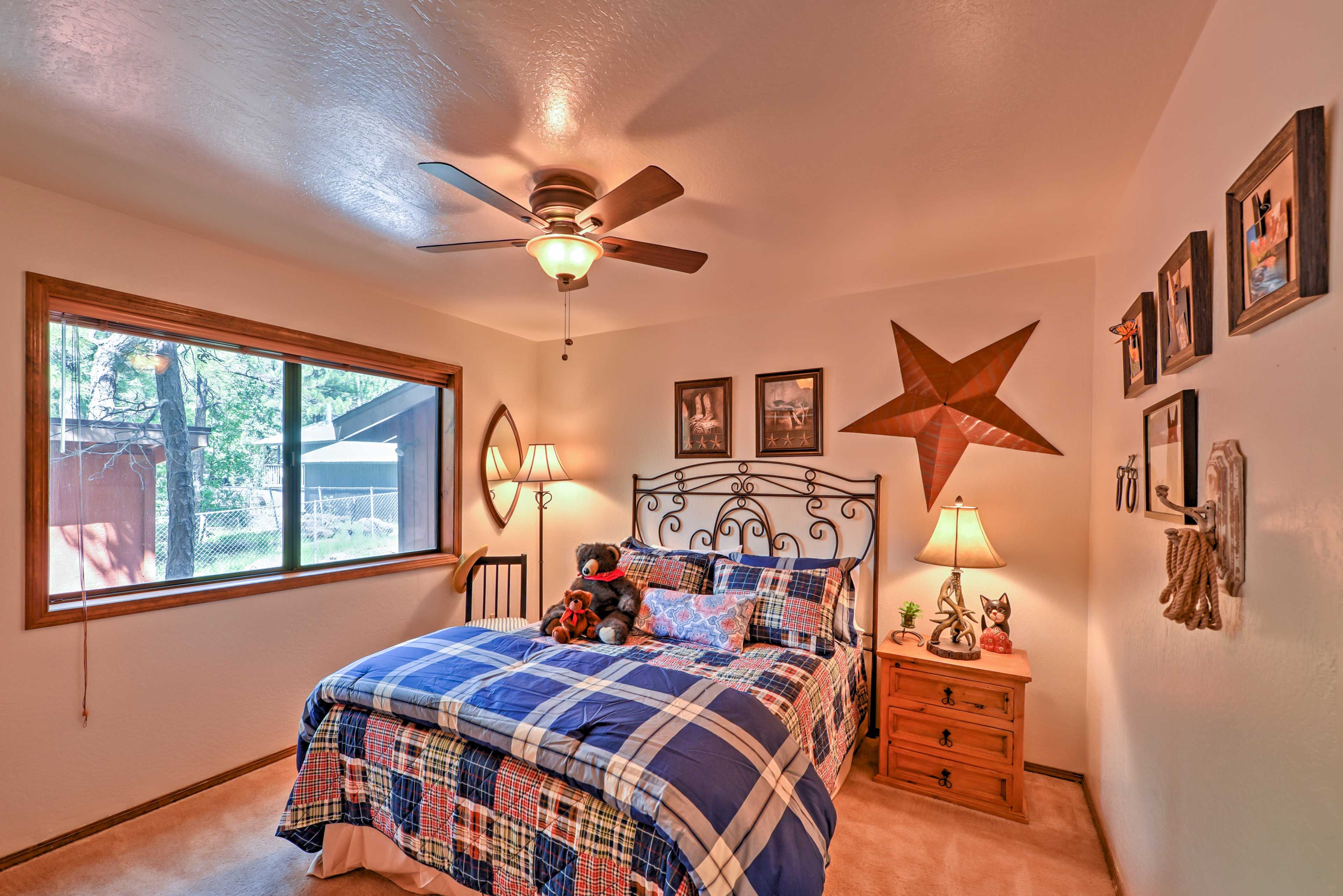 The first floor bedroom features a queen-sized bed.