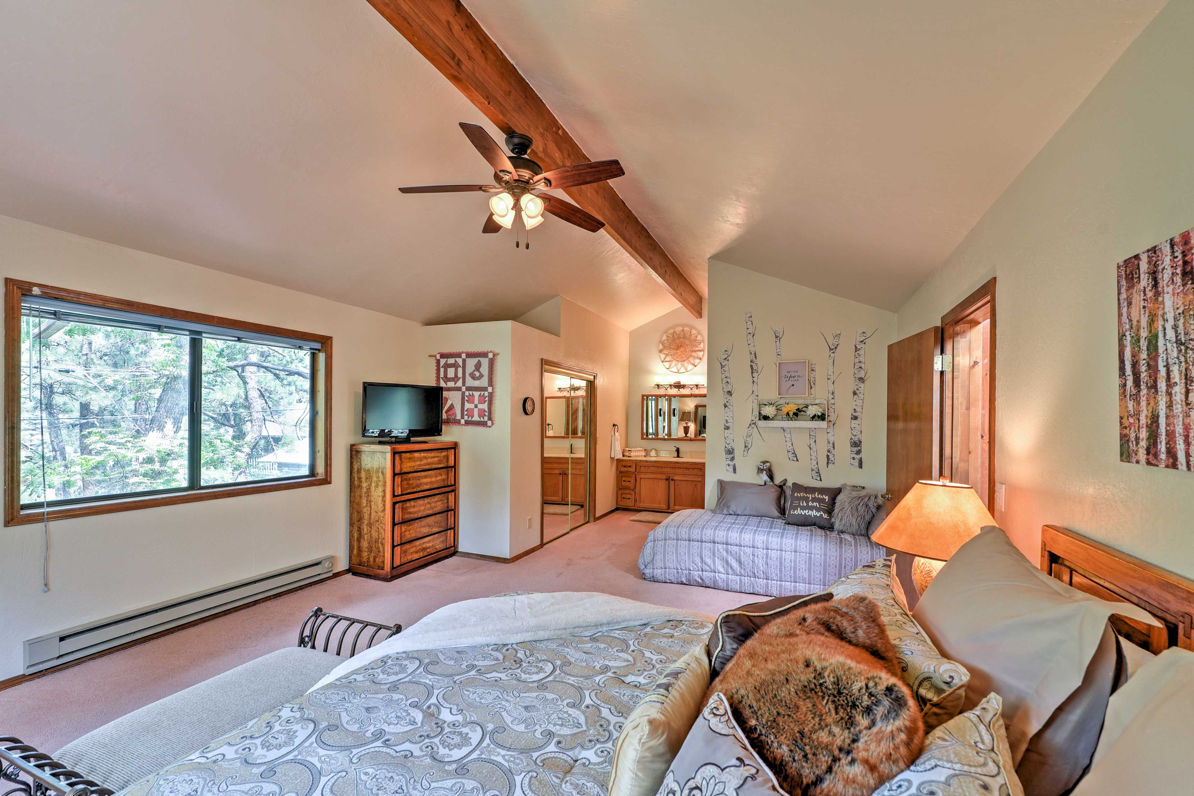 The suite boasts a king bed and a twin-sized bed with a twin trundle pullout