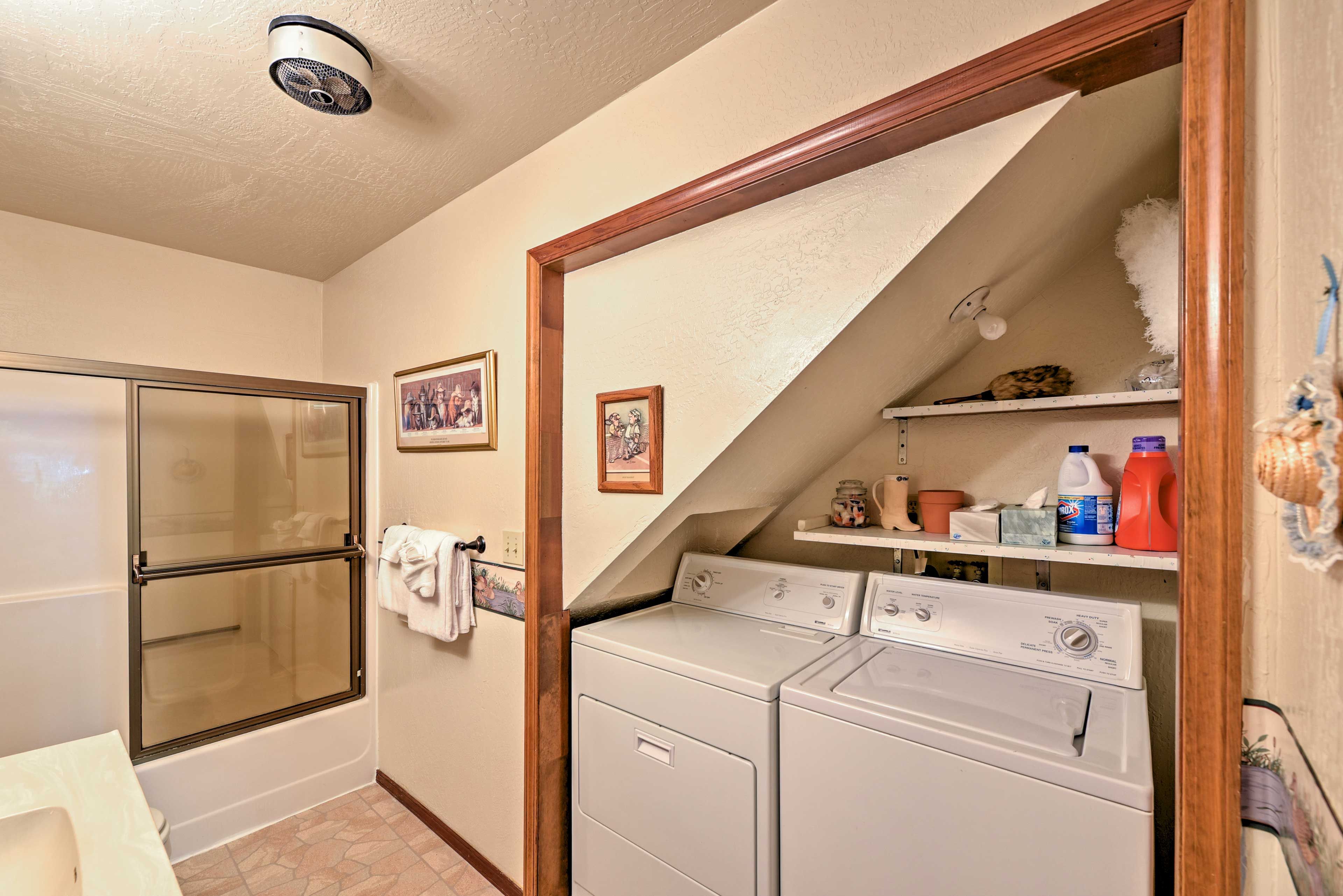The in-unit laundry machines are located in the en-suite bathroom.