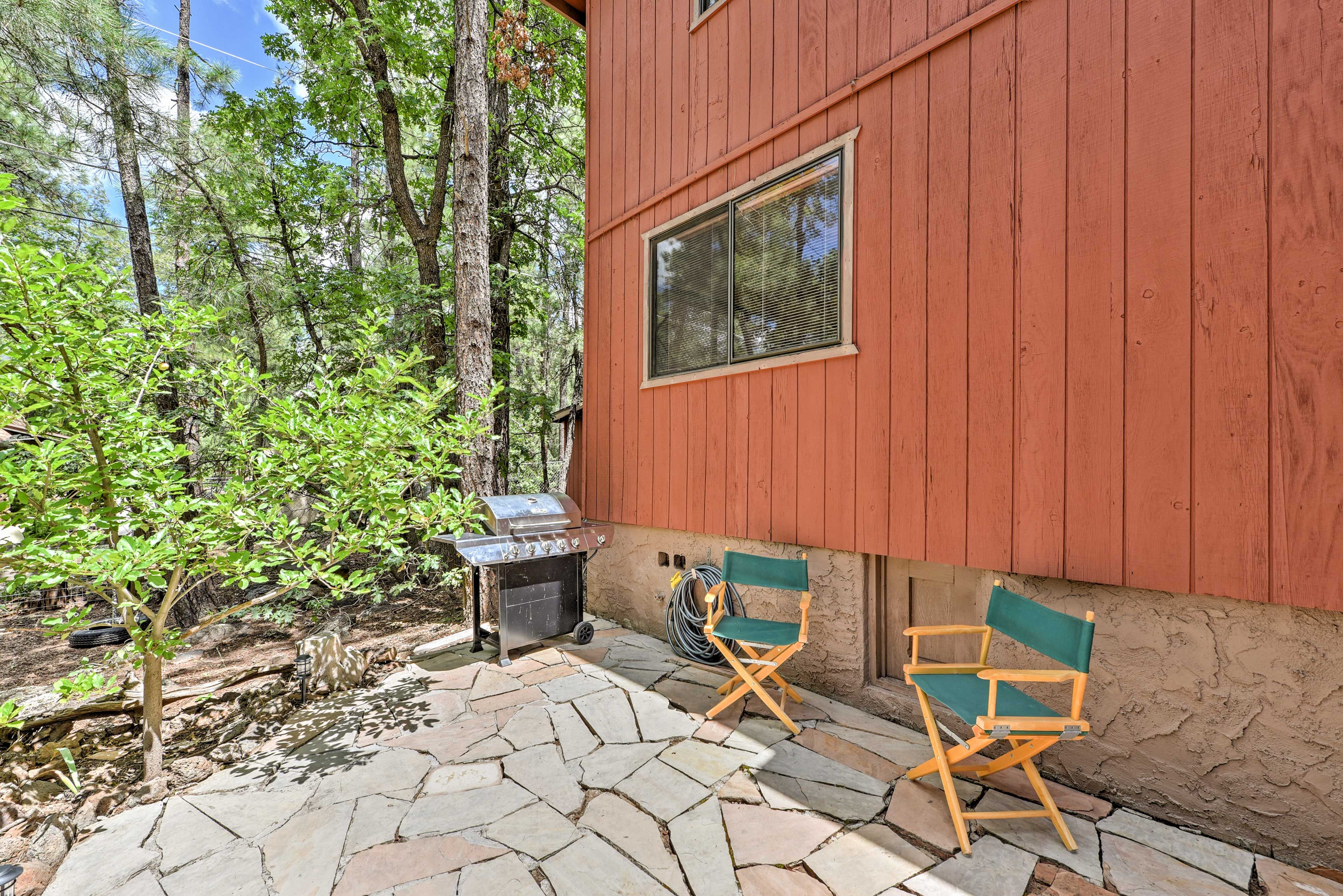 The flagstone patio is a perfect place to fire up the gas grill for a barbecue.