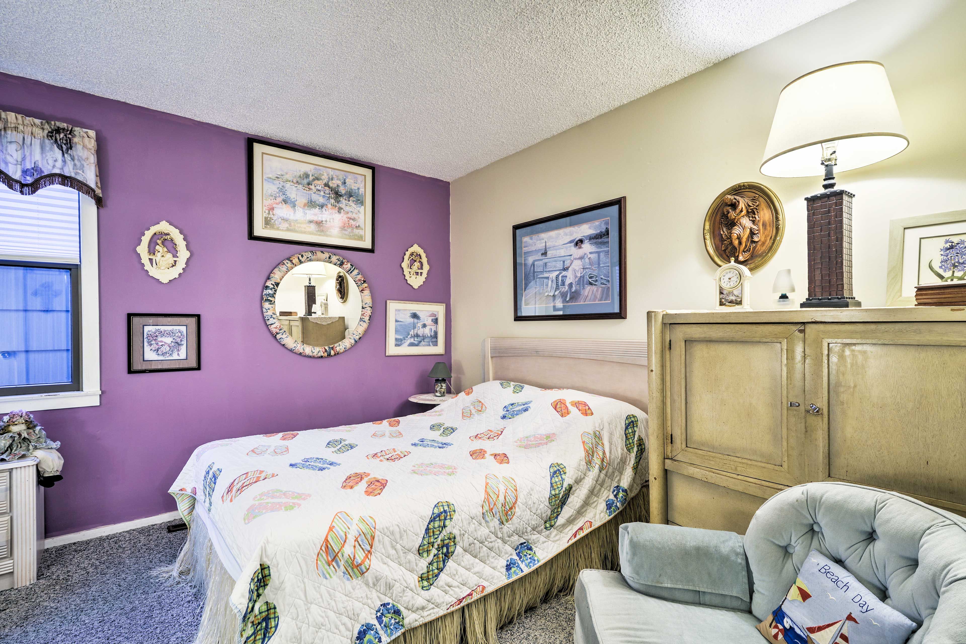Sleep easy on the full bed in this bedroom.