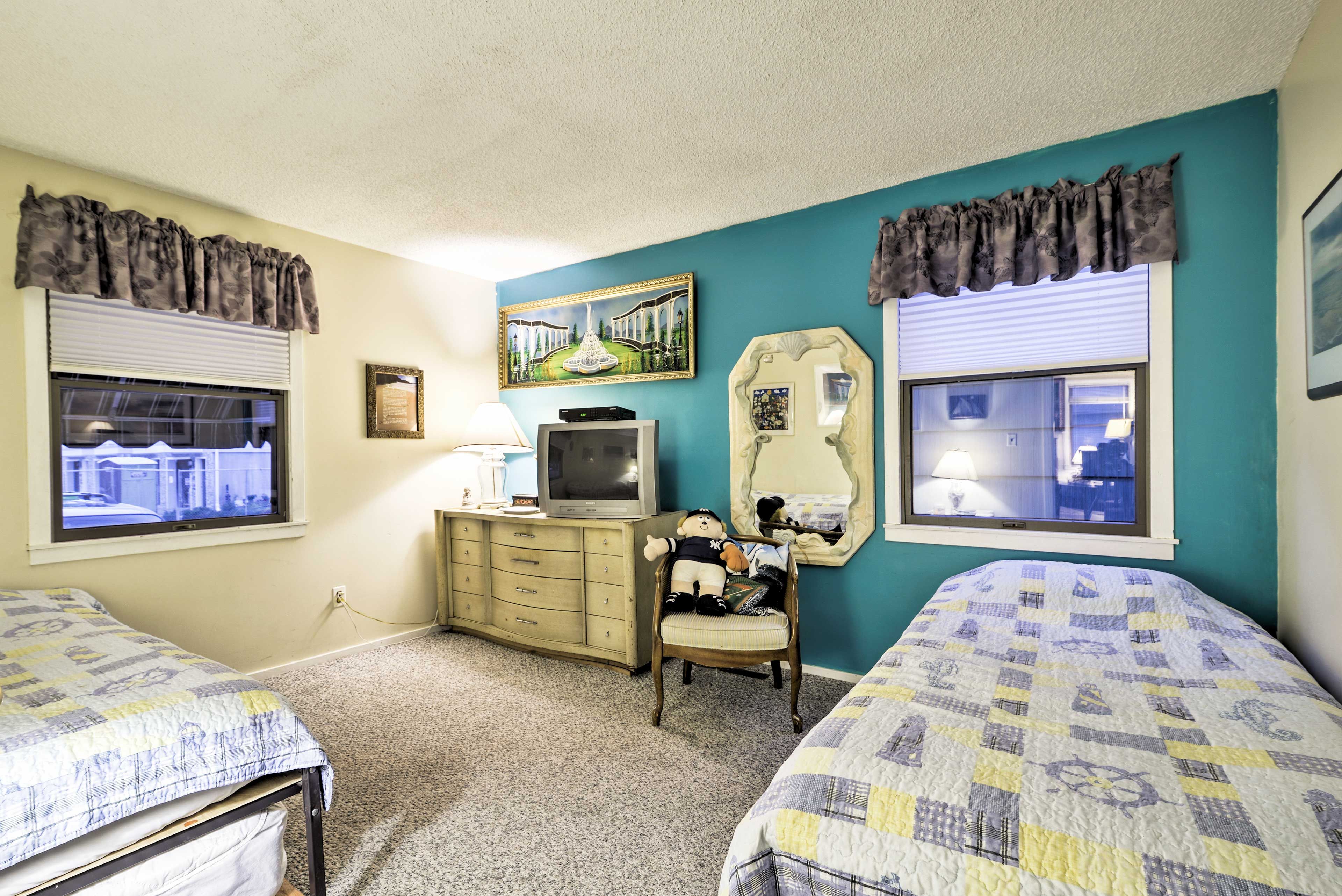 This bedroom includes 2 twin beds with twin trundles.