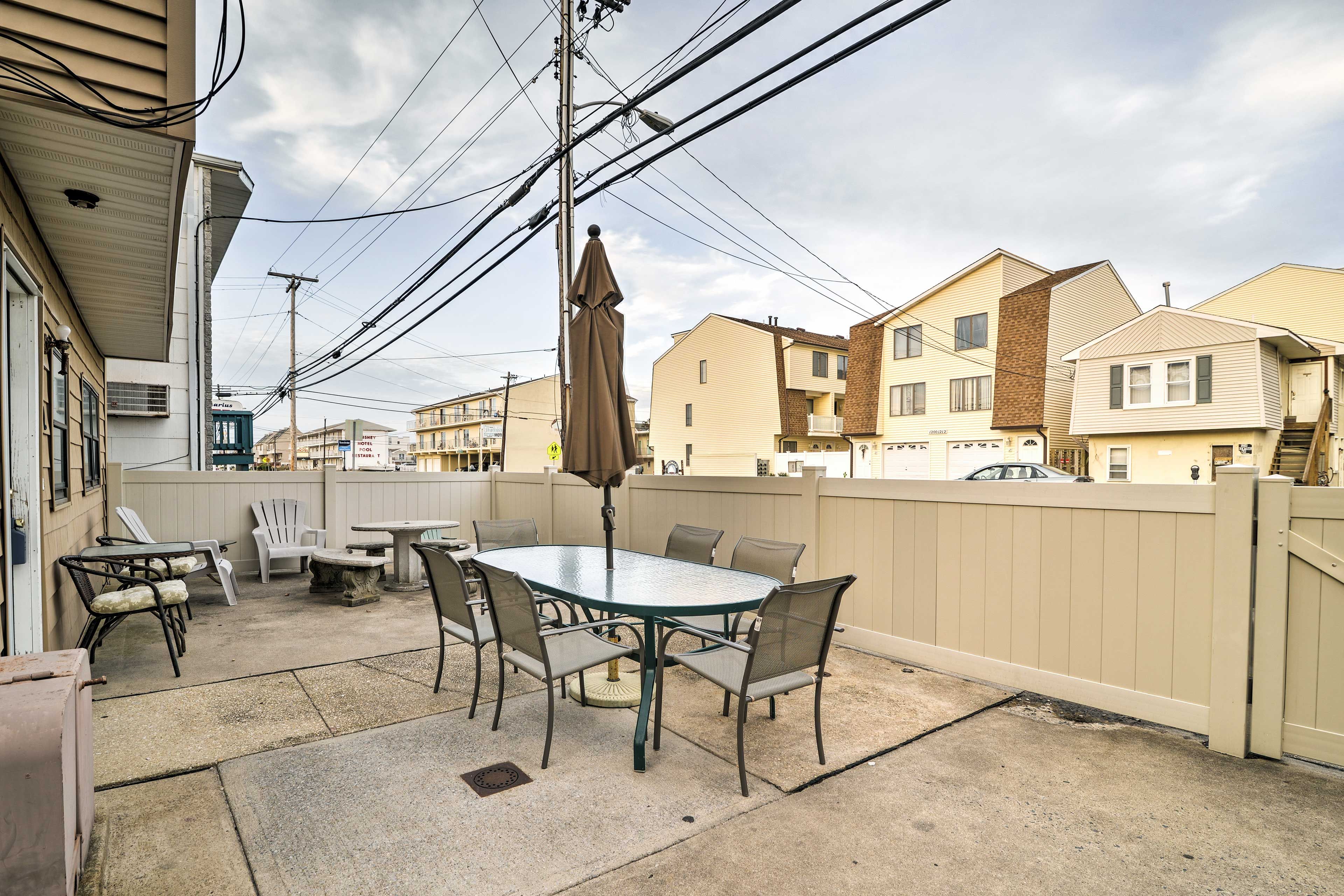 The fenced-in patio is an ideal space to gather with family and friends.