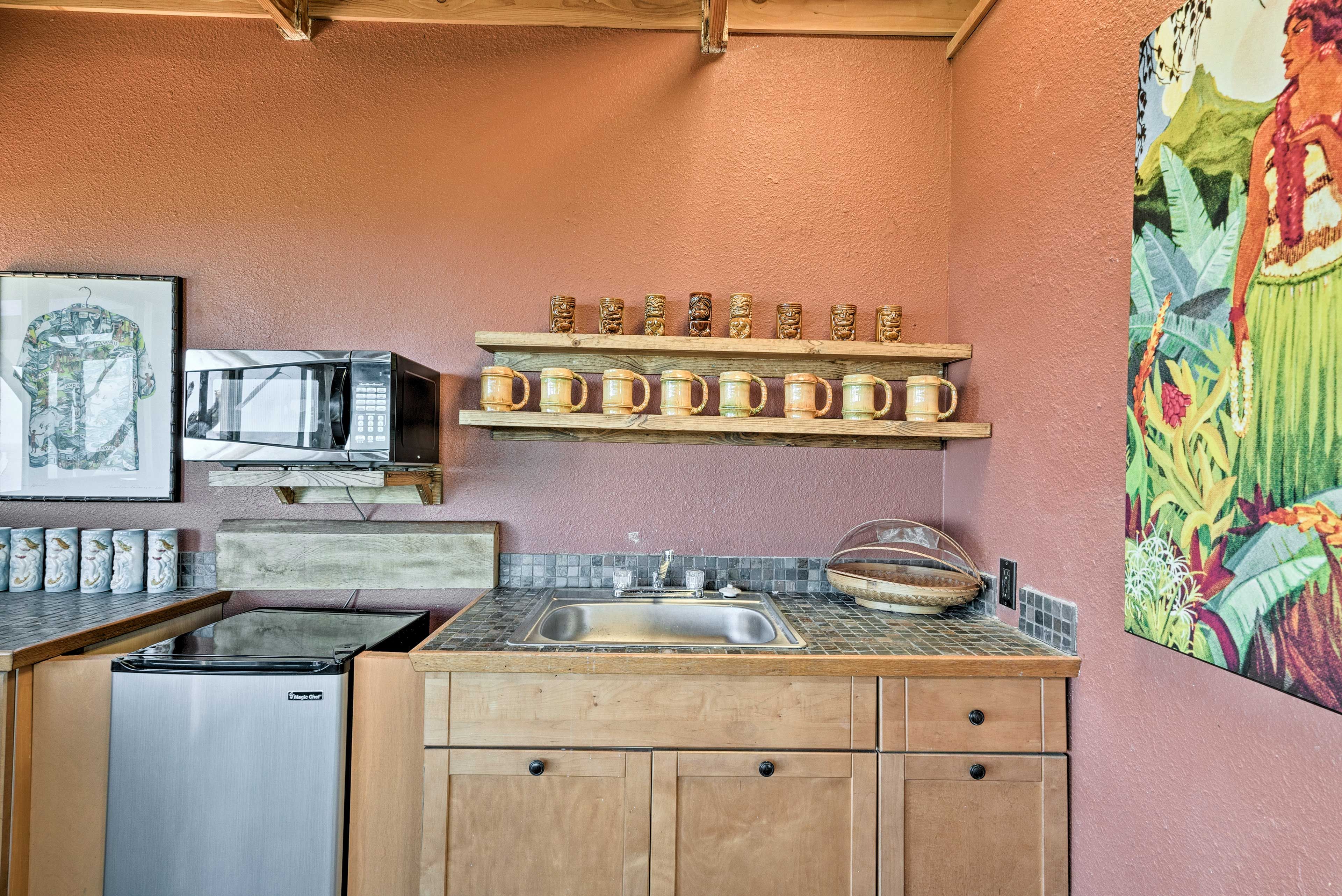 With an expansive tile counter, the kitchen is convenient and useful.
