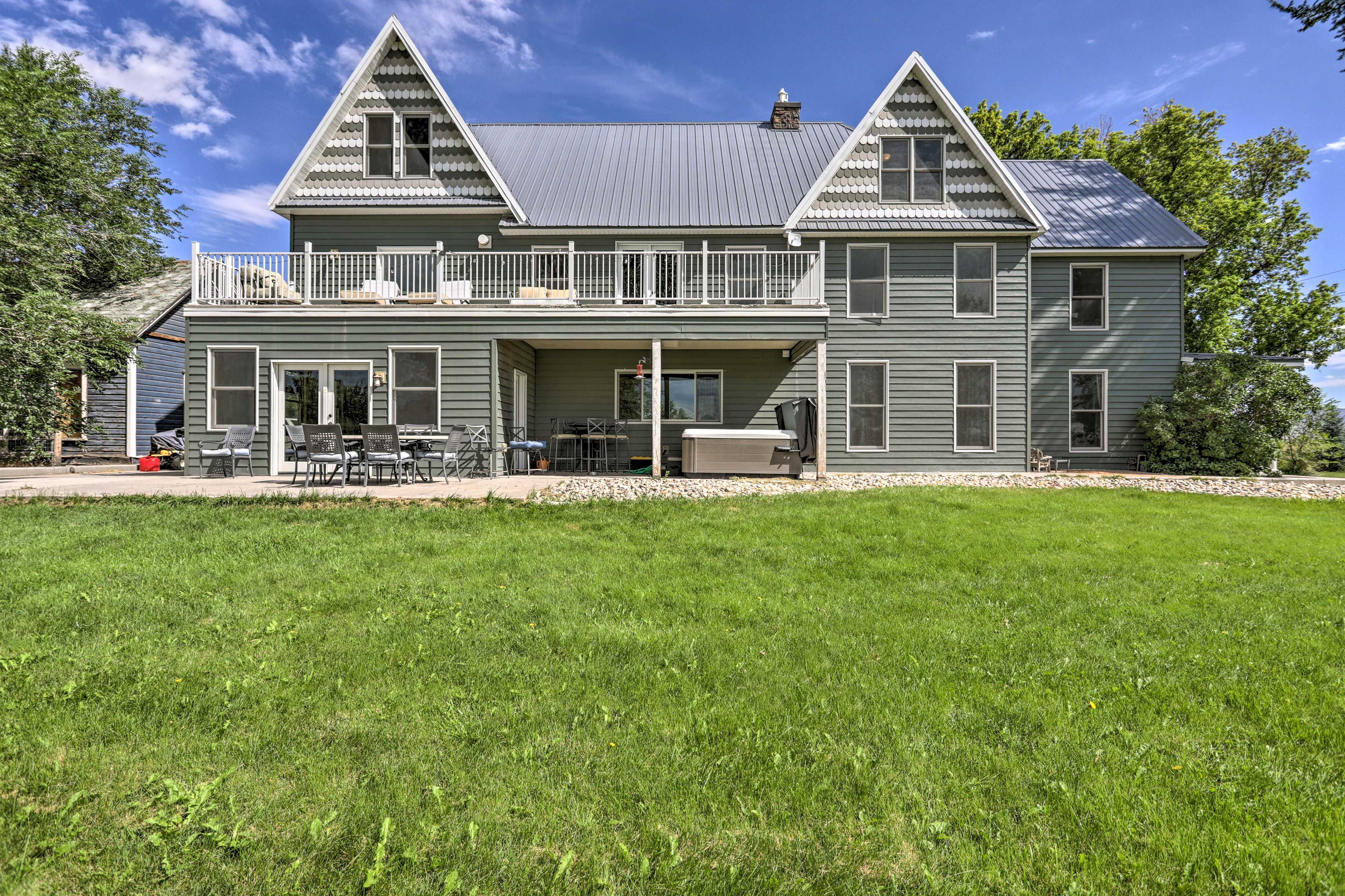 Backyard | Hot Tub | Outdoor Dining | Covered Seating | Sun Deck | Loungers