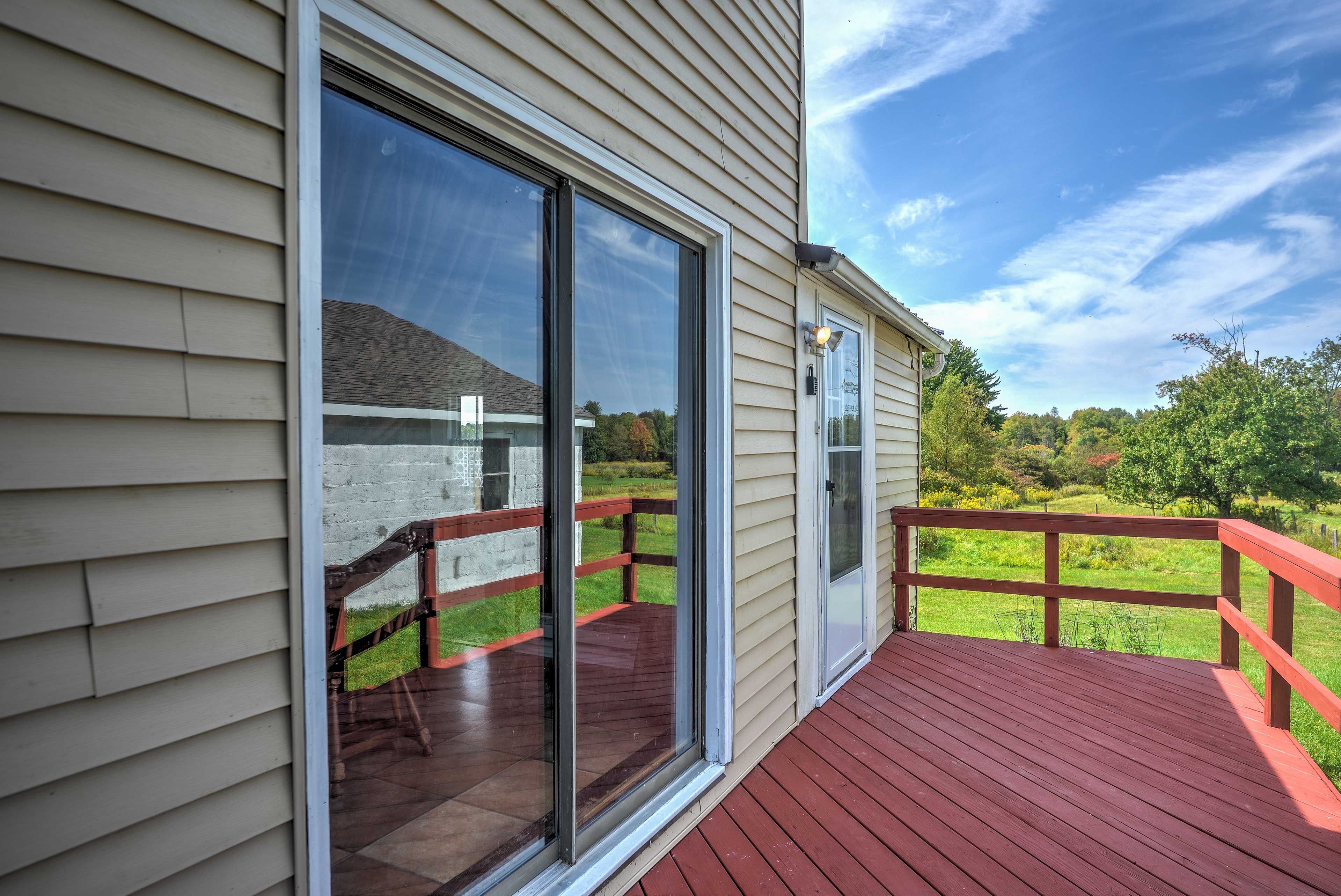 Step through the sliding glass door onto the back deck.