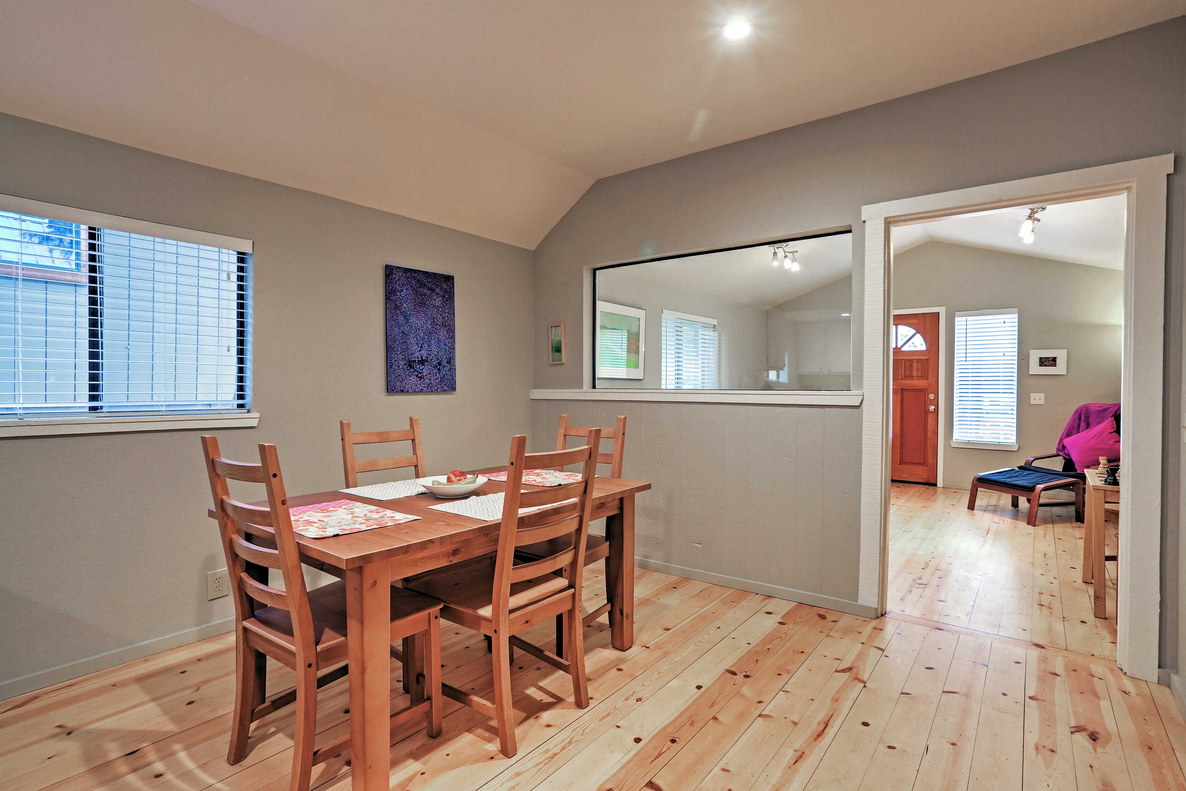 Dine on a delicious home-cooked meal at the wood table with seating for 4.