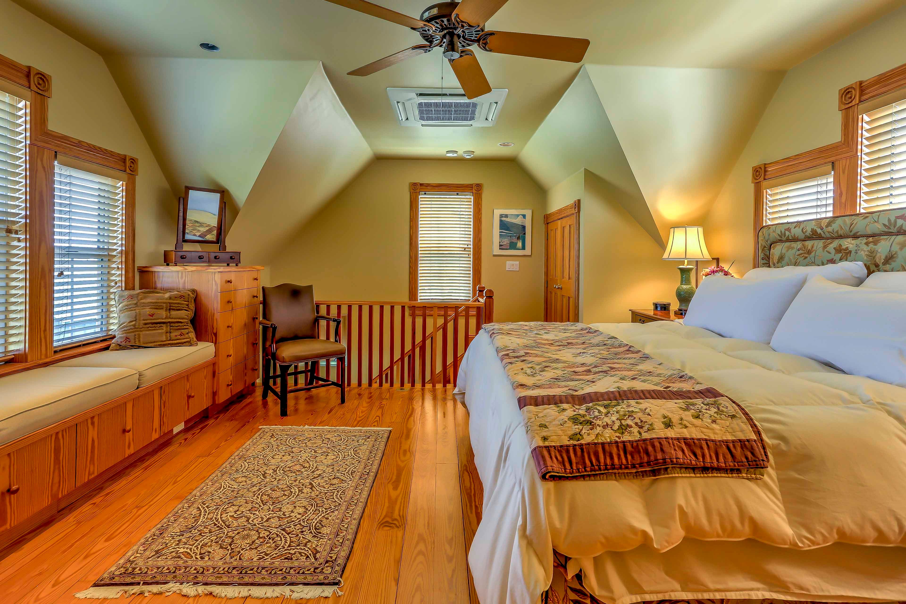 This bedroom boasts a plush king-sized bed and reading nook.