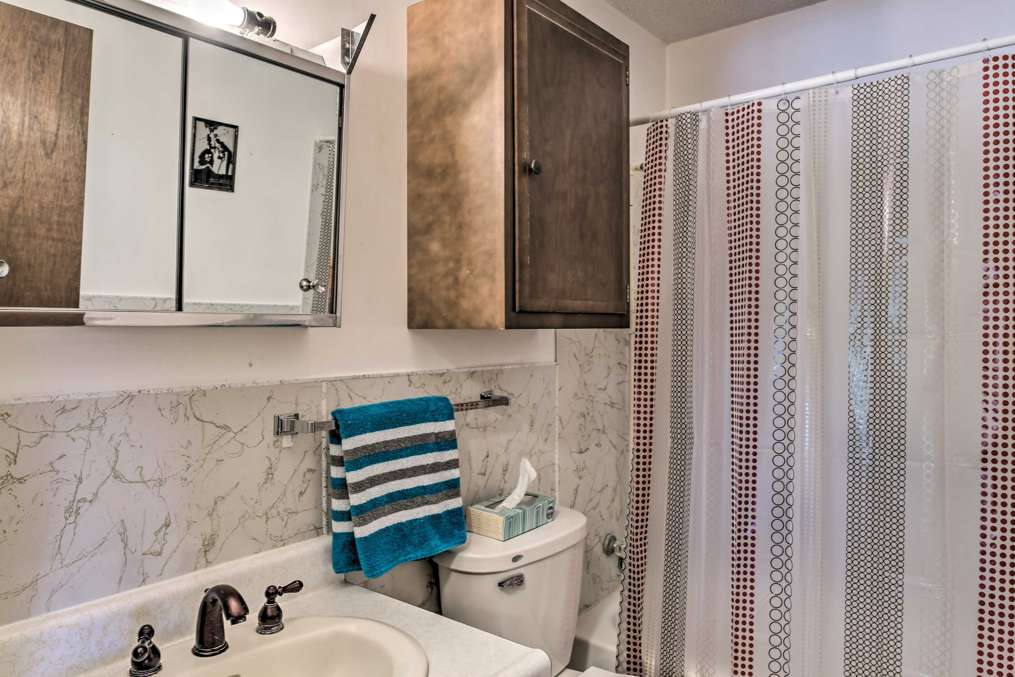 The bathroom offers a great shower/tub combo.