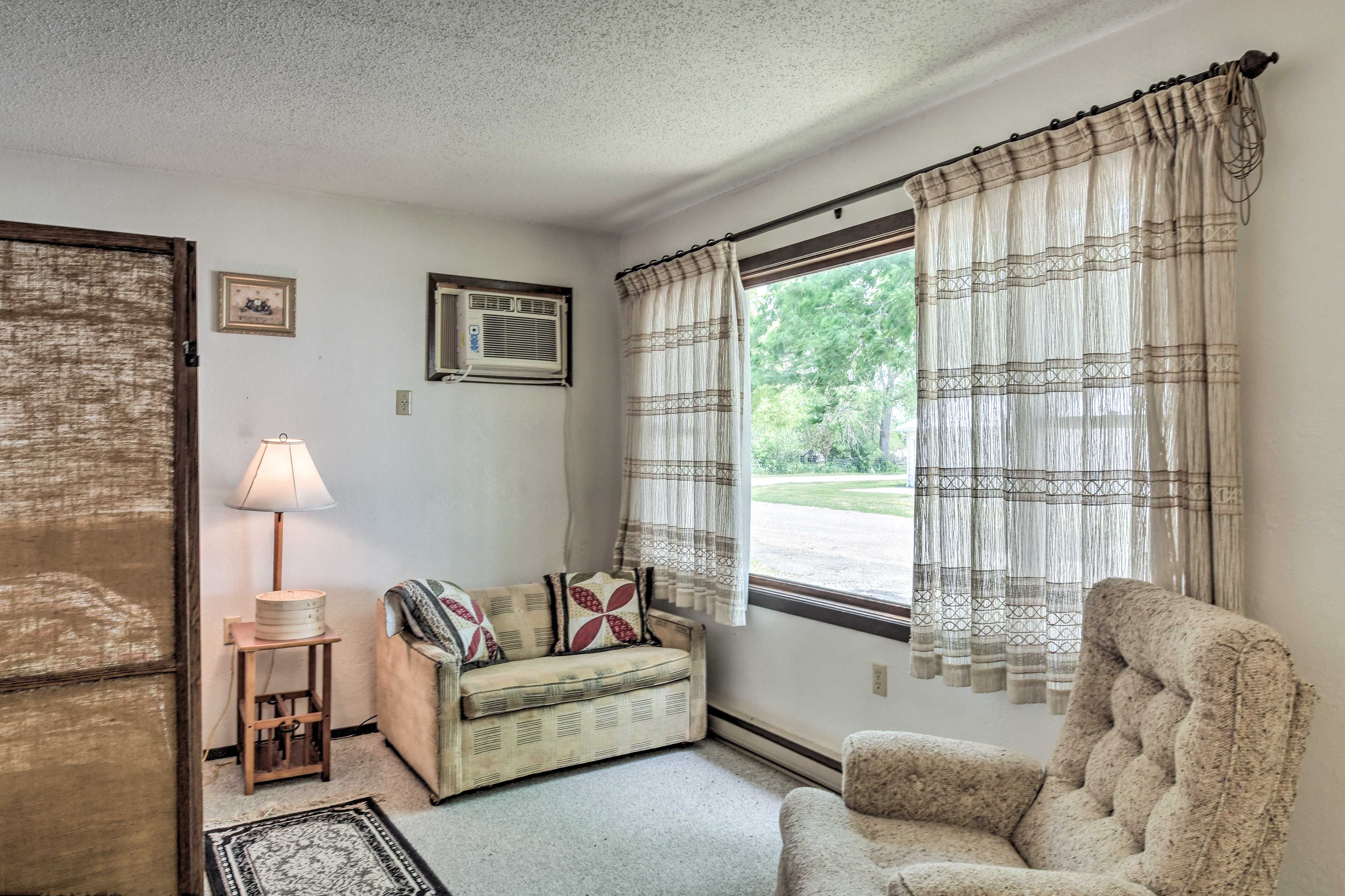 This 1-bedroom, 1-bath living space hosts cozy furnishings.