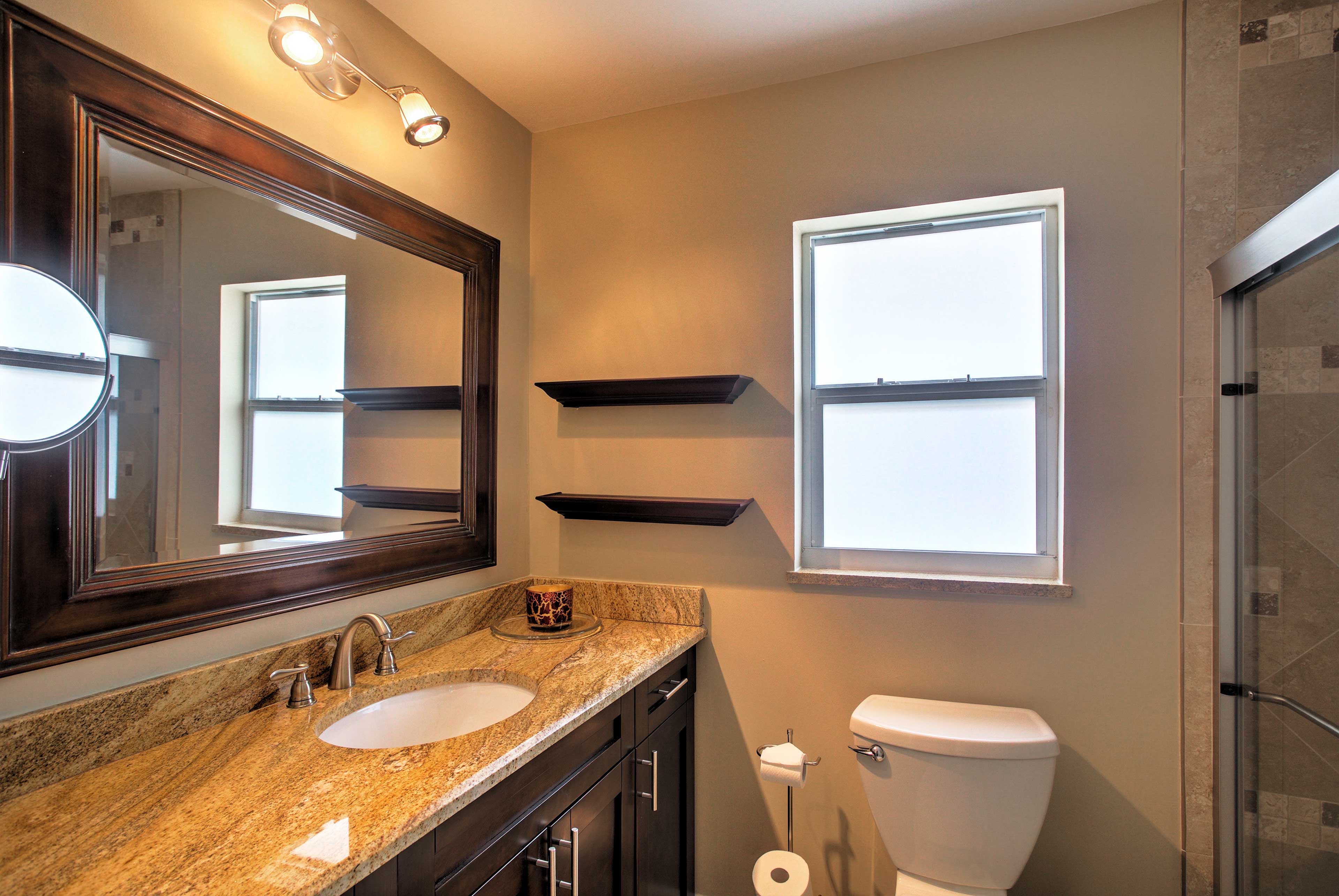 A second full bathroom is stocked with fresh towels.