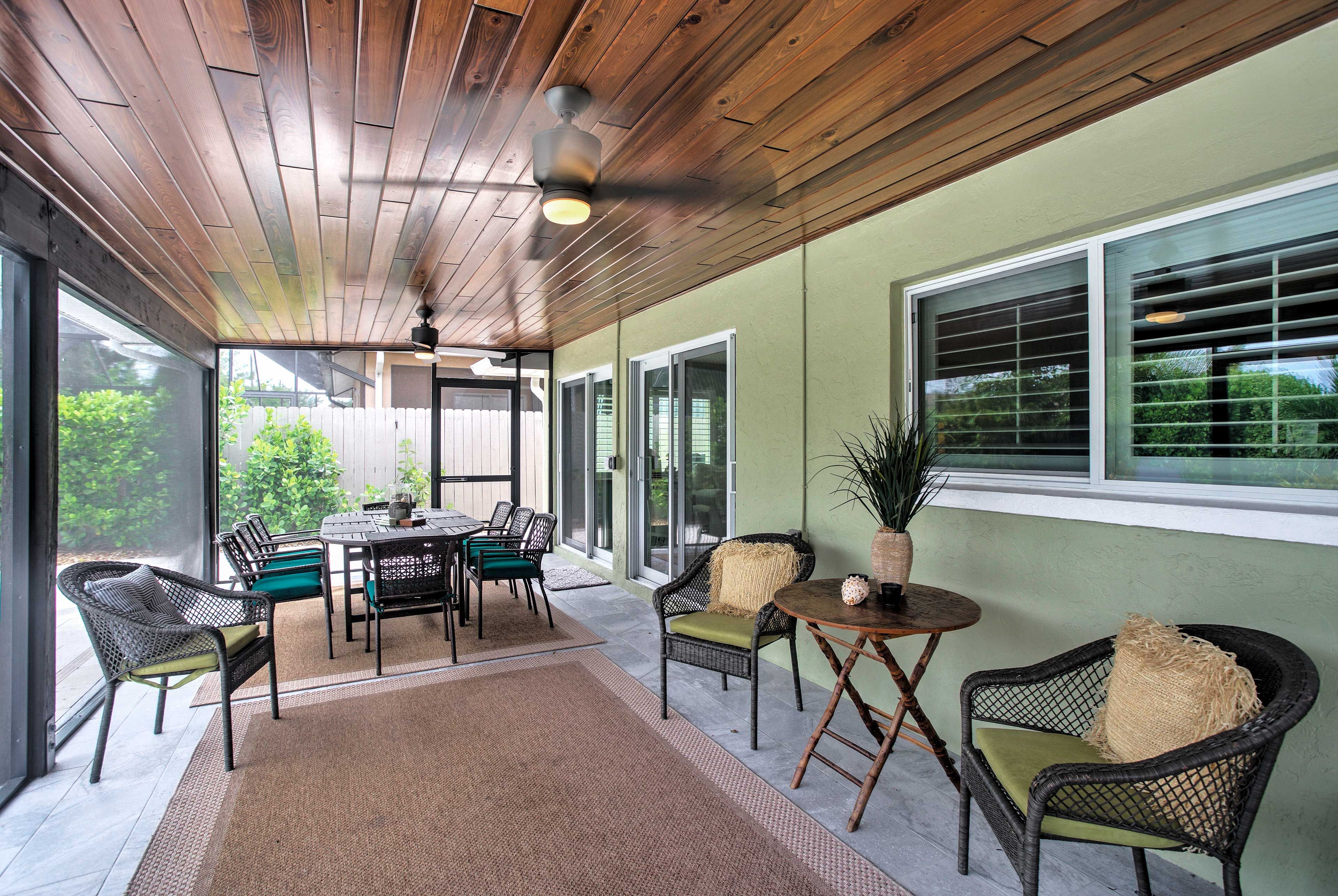 Ample outdoor furniture allows everyone to gather comfortably in the lanai.