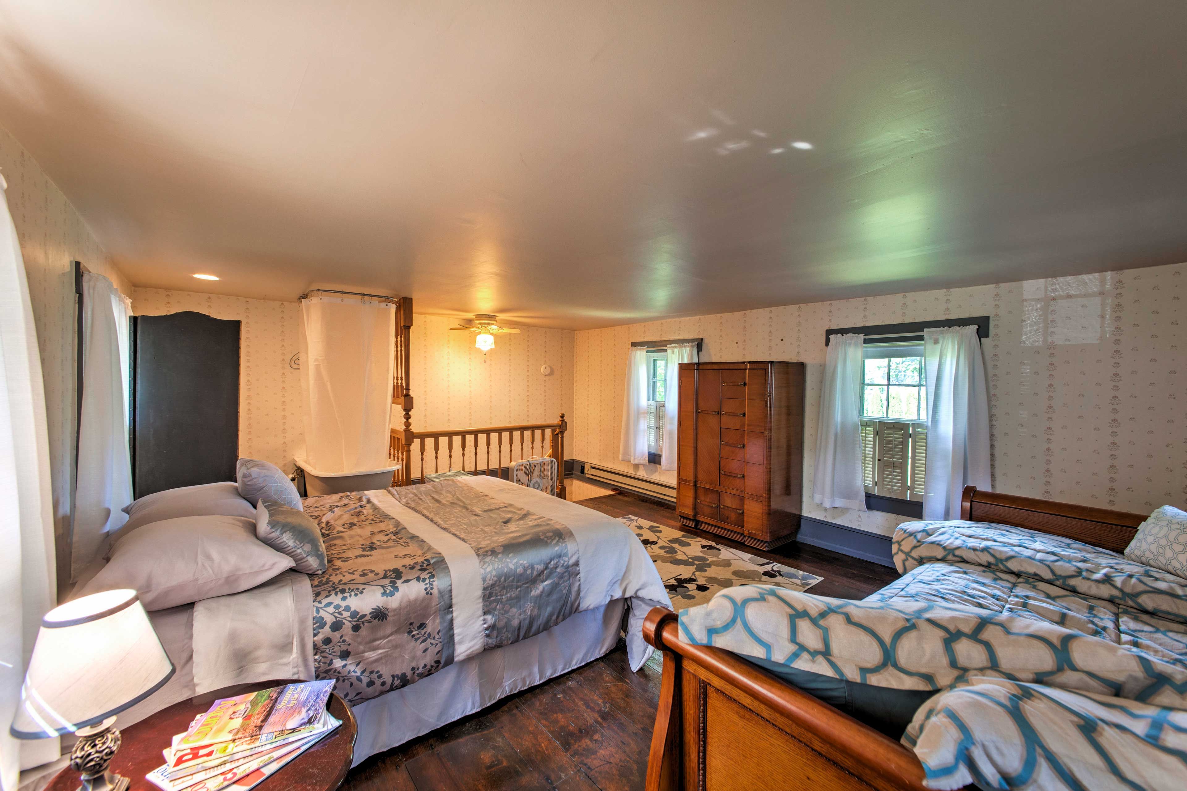 Head upstairs to rest and relax in the bedroom that hosts a queen and twin bed.