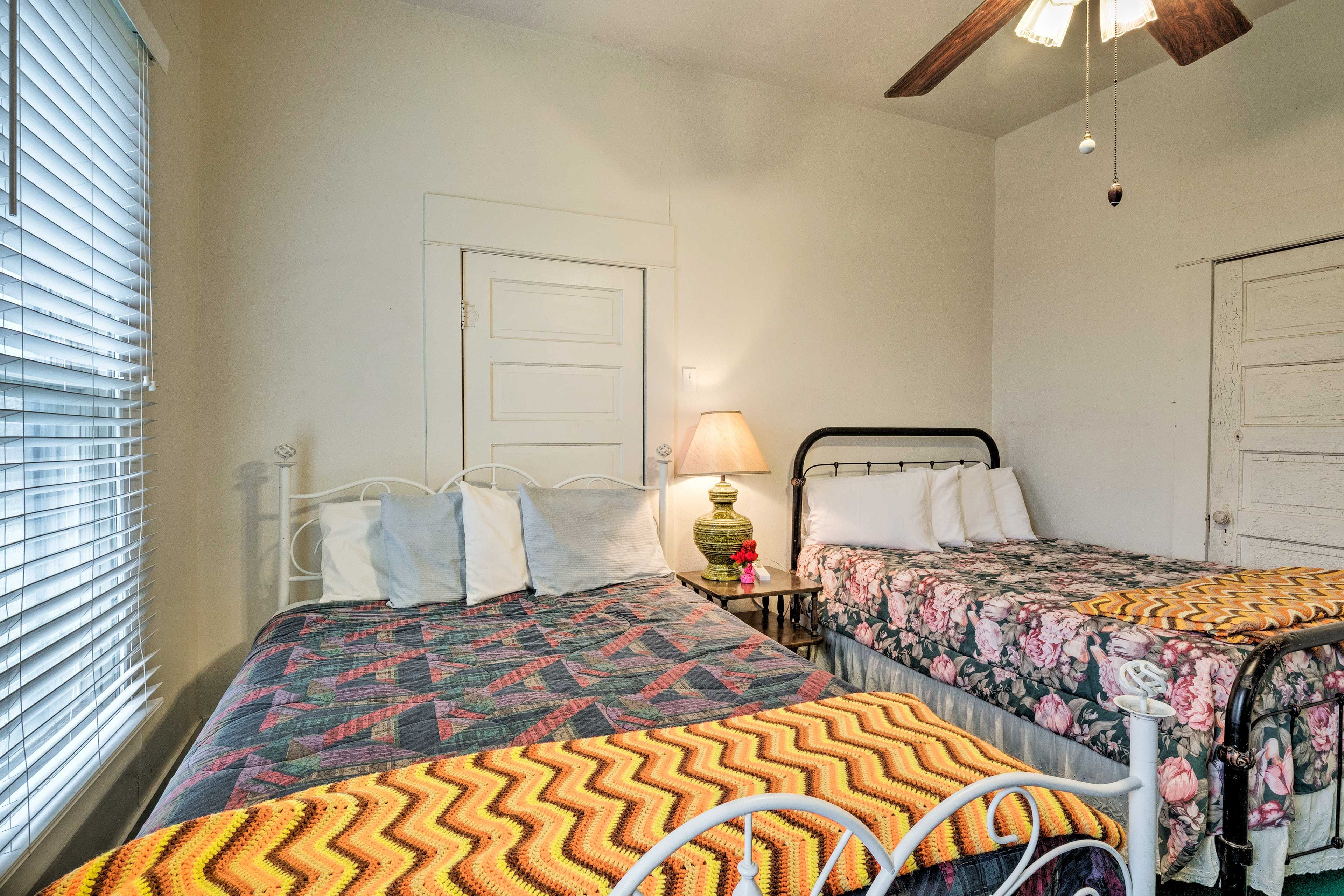 The first part of the bedroom offers a full and queen bed.