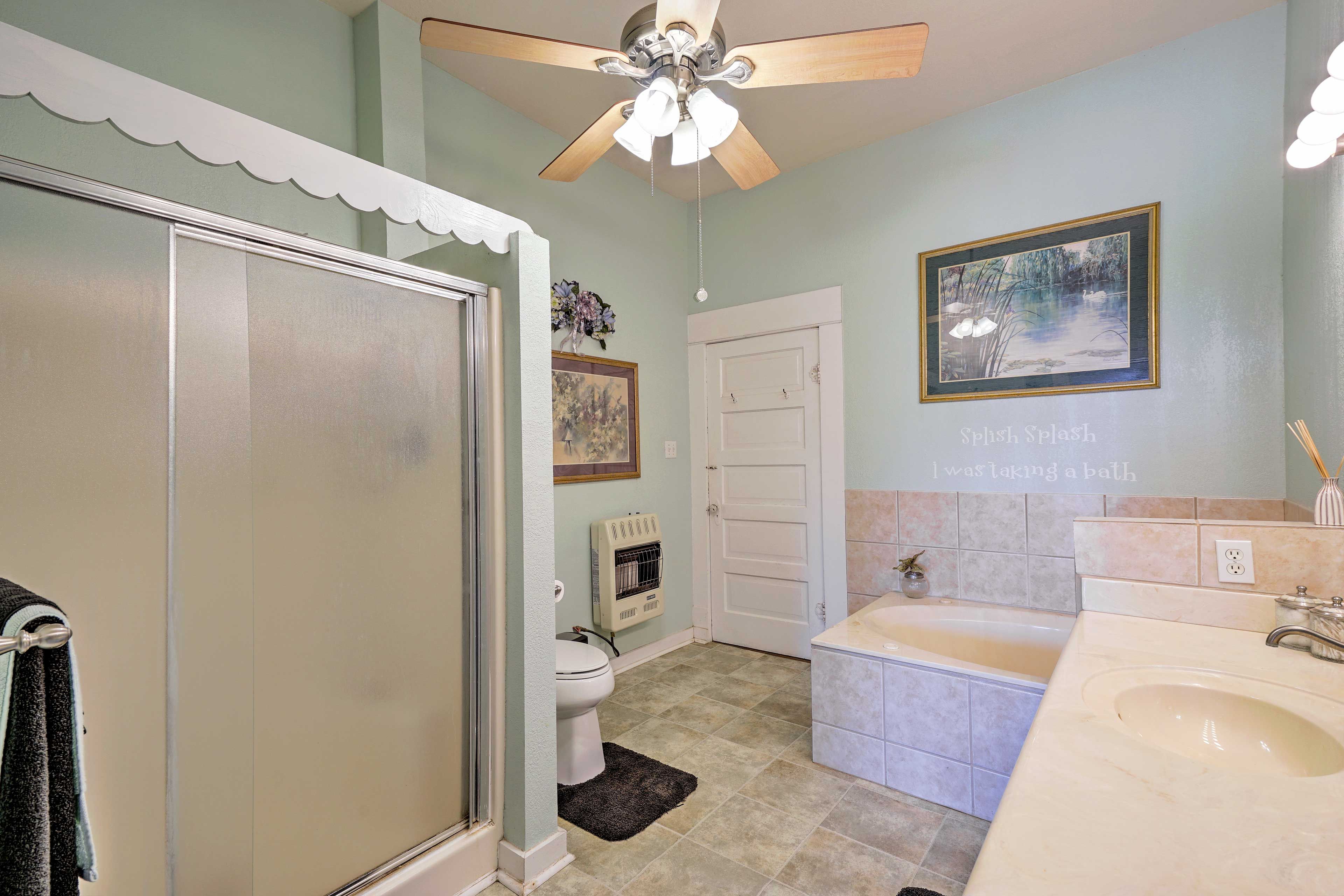 Both a spacious tub and walk-in shower are available in this bathroom.